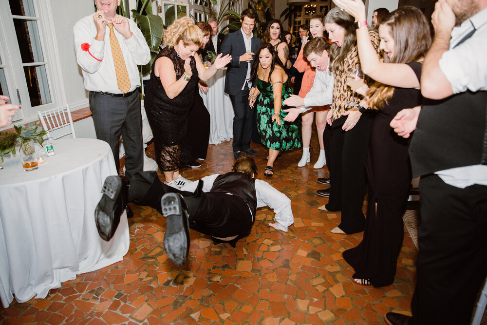  Reception dancing | Sarah Mattozzi Photography | Black tie wedding at The Historic Cavalier Hotel, Virginia Beach | Tropical, elegant wedding inspiration, black tux groom, glam bride, greenery bouquets, sentimental, classic, minimalist wedding. 
