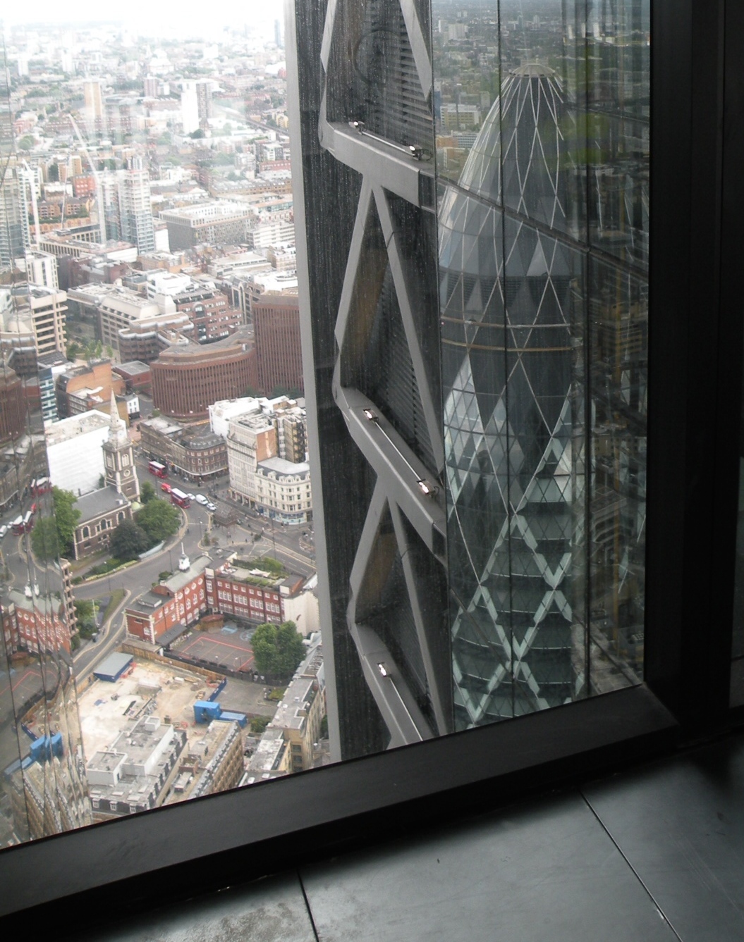 The Gherkin reflected in the Cheesegrater