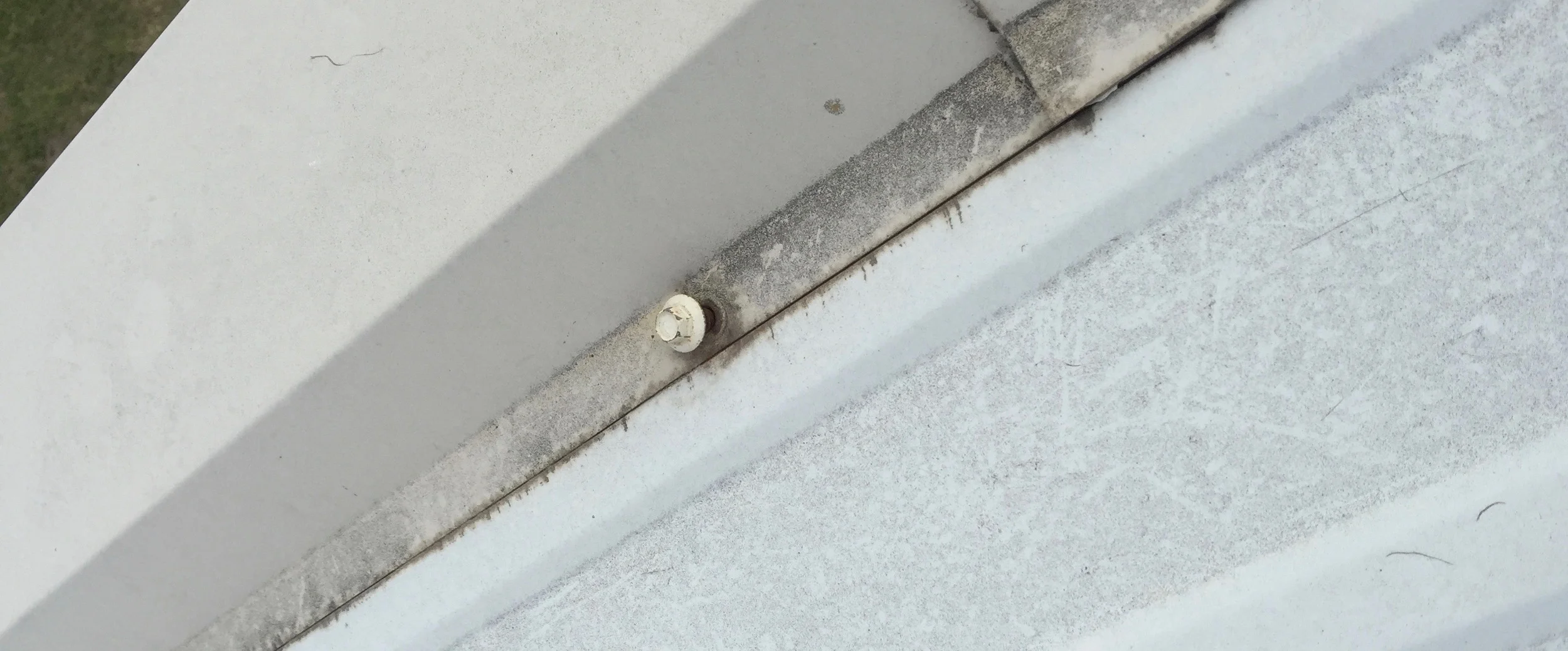Backed Out Fastener - requires metal roof leak repair services