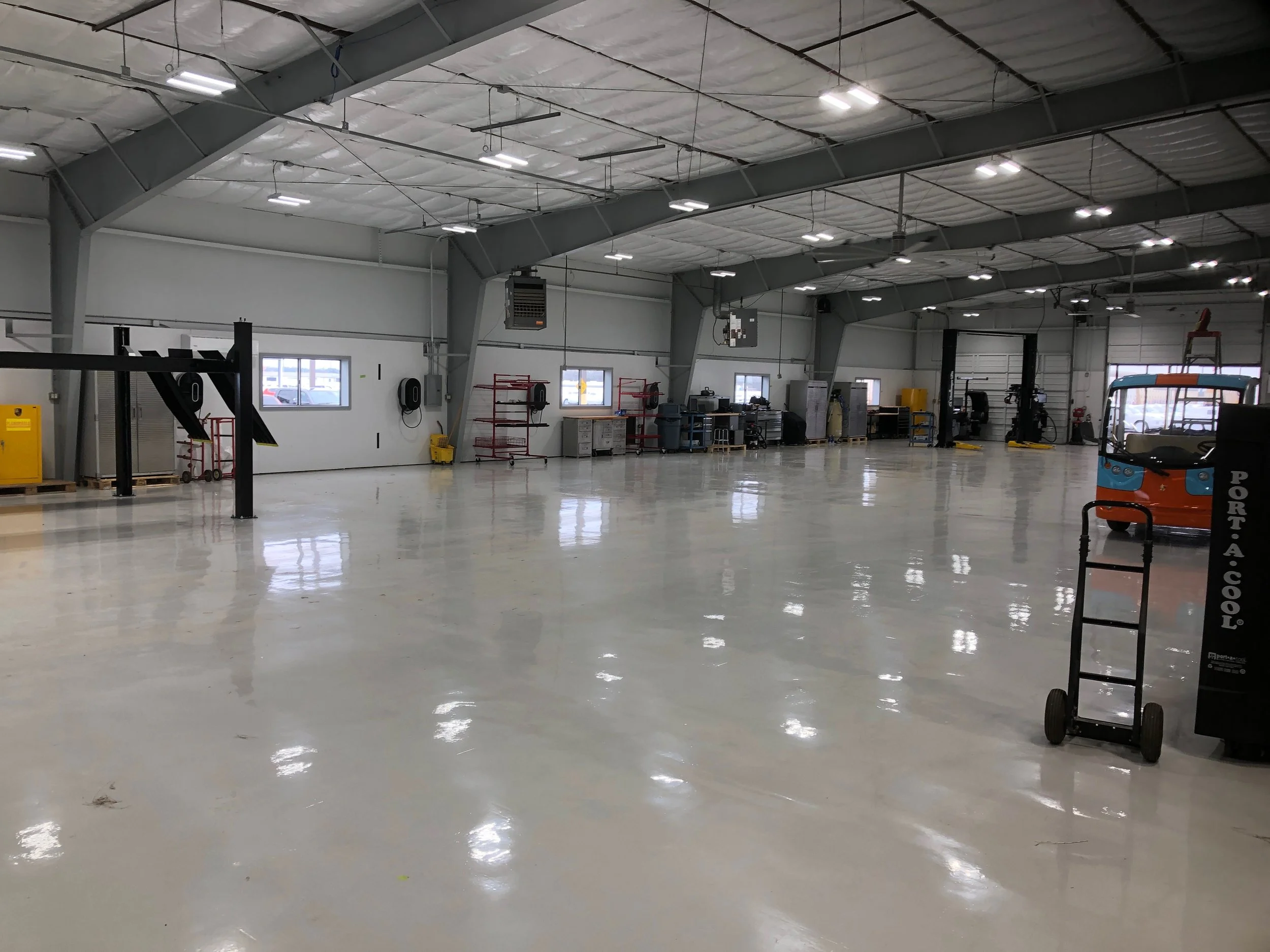 This was a complete Metal building renovation performed by Metalguard; New floor coating, walls and columns painted, new lighting system, 8” insulation, R-30, retro-installed insulation into the ceiling in this metal building. It is beautiful. Completed January 2019. This is helping to keep the building cool