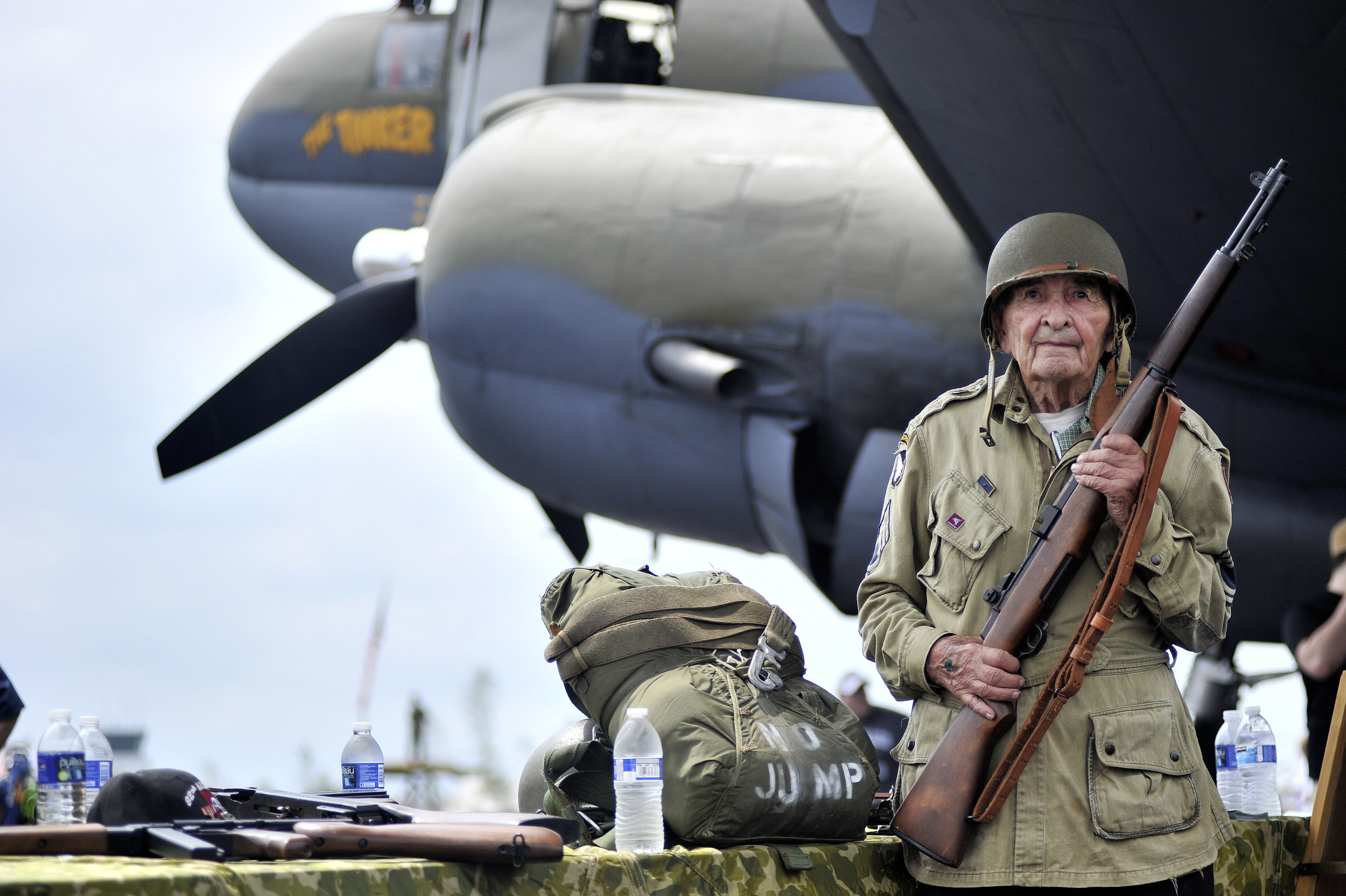 D-Day veteran Donald Rutter, 94, poses for a portrait in front of "The Tinker Belle," a Curtiss C46 Commando military transport plane, at the World War II Weekend in Reading, PA, on June 4, 2016. (Reading Eagle: Sarah Stier)