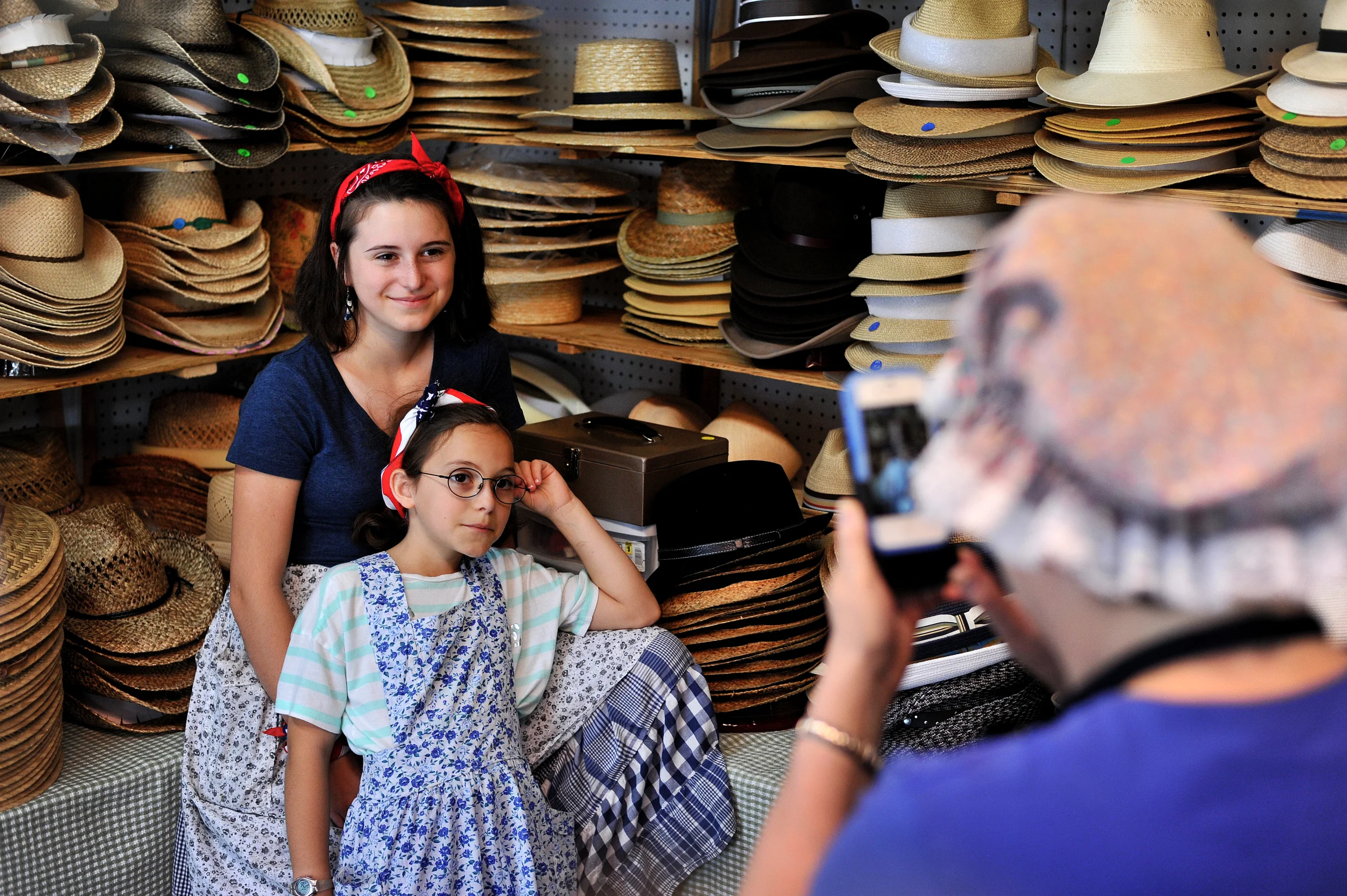 Andrea Neulight of Allentown takes a photo of her granddaughters Olivia Neulight, 13, and Journey Neulight, 10, of Venice, California, at the Kutztown Folk Festival in Kutztown, PA, on July 4, 2016. (Reading Eagle: Sarah Stier)