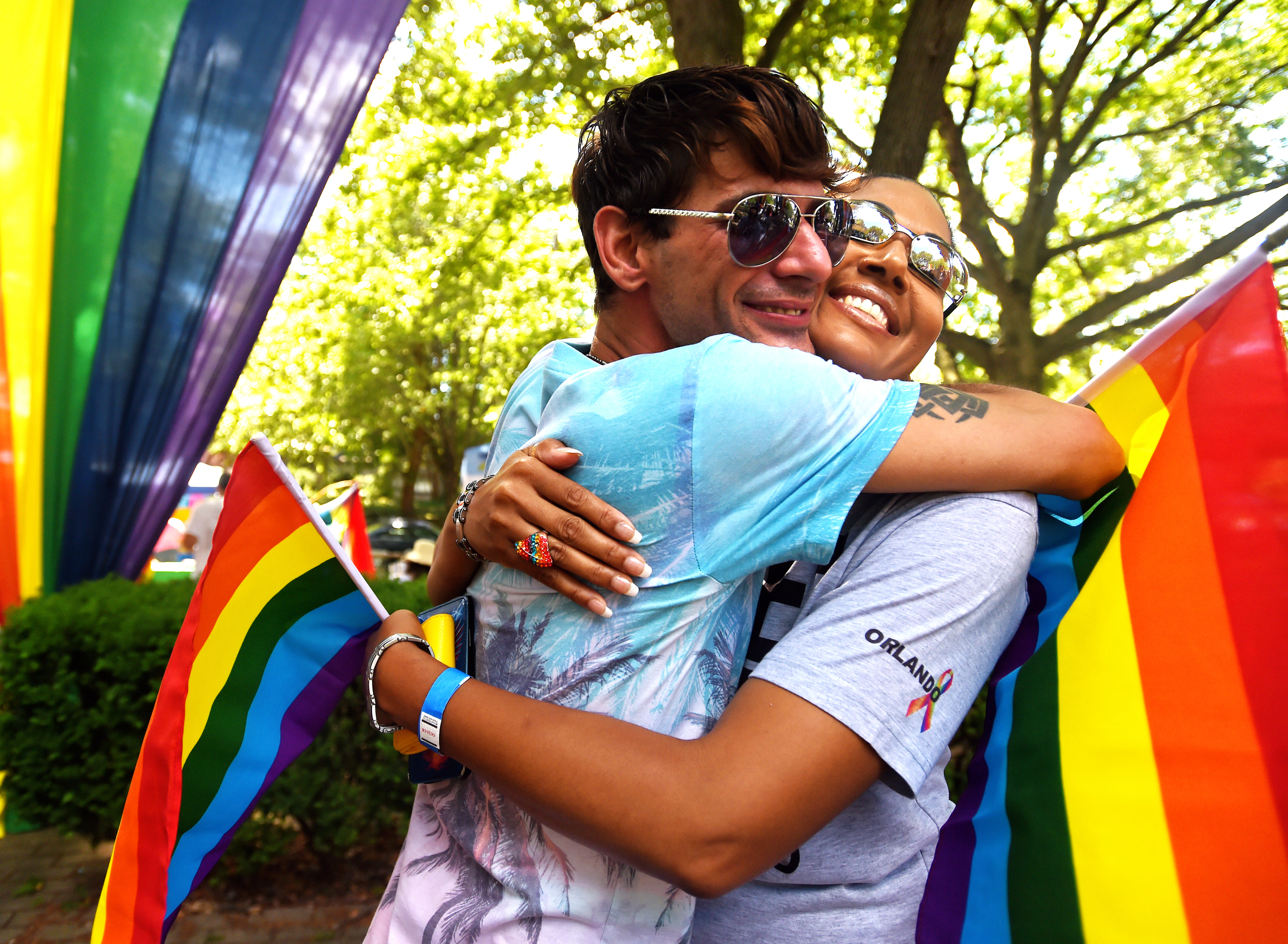 Michael Creel (left) and Carmen Calderon of Reading share a hug at the Reading Pride Festival at Centre Park in Reading, PA, on July 17, 2016. (Reading Eagle: Sarah Stier)