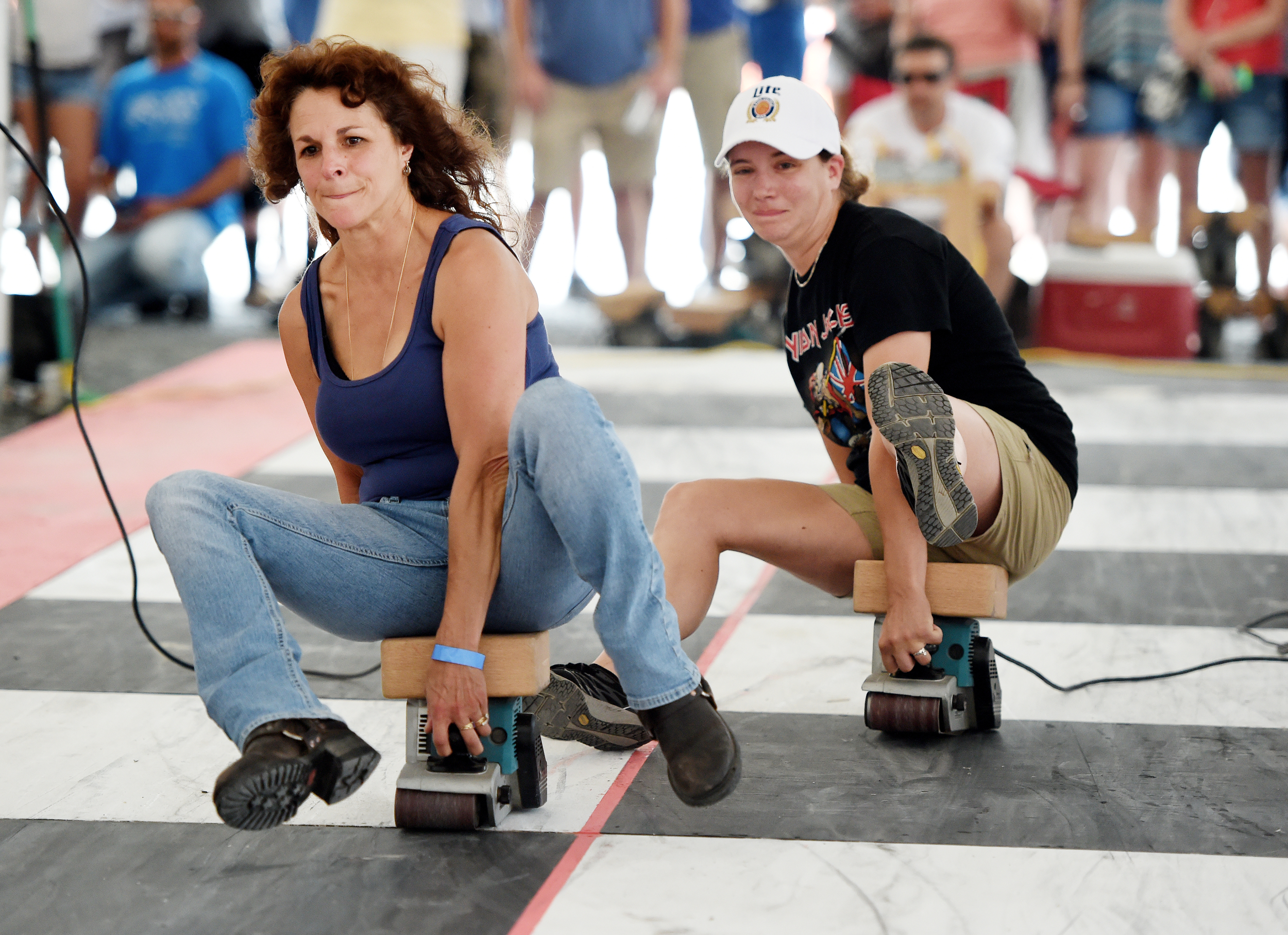 Denise Zerbe of Exeter (left) races against Amber Shubert of Boyertown at the 26th Annual Belt Sander Race at Bertie's Inn in Exeter Township on July 16, 2016. The race benefits the National Multiple Sclerosis Society of Greater Delaware chapter. (Reading Eagle: Sarah Stier)
