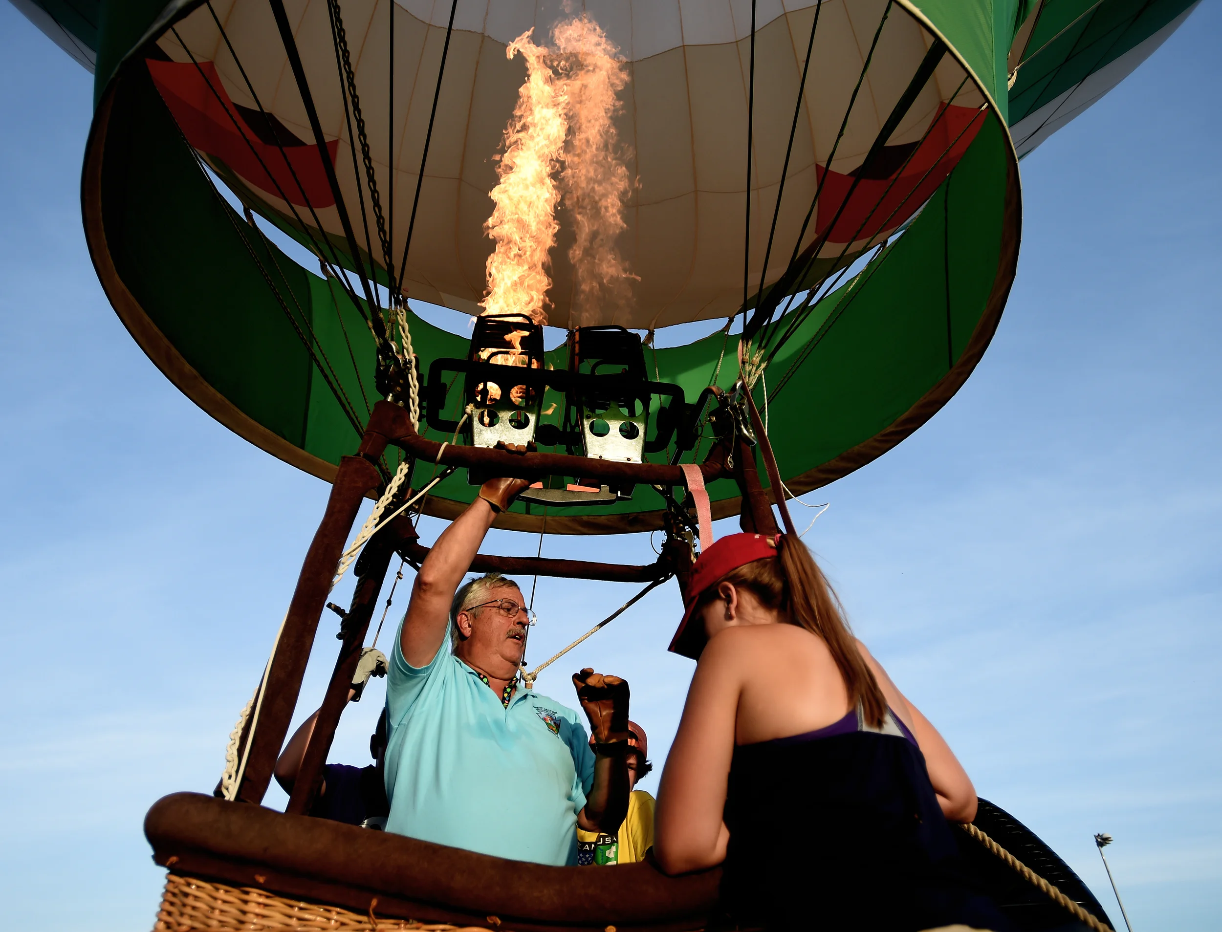Steve Esser of Kutztown pumps hot air into his balloon during the Great Eastern Balloon Camp at Kutztown University in Kutztown, PA, on July 11, 2016. The balloon camp teaches youngsters the basics of flying hot balloons. (Reading Eagle: Sarah Stier)