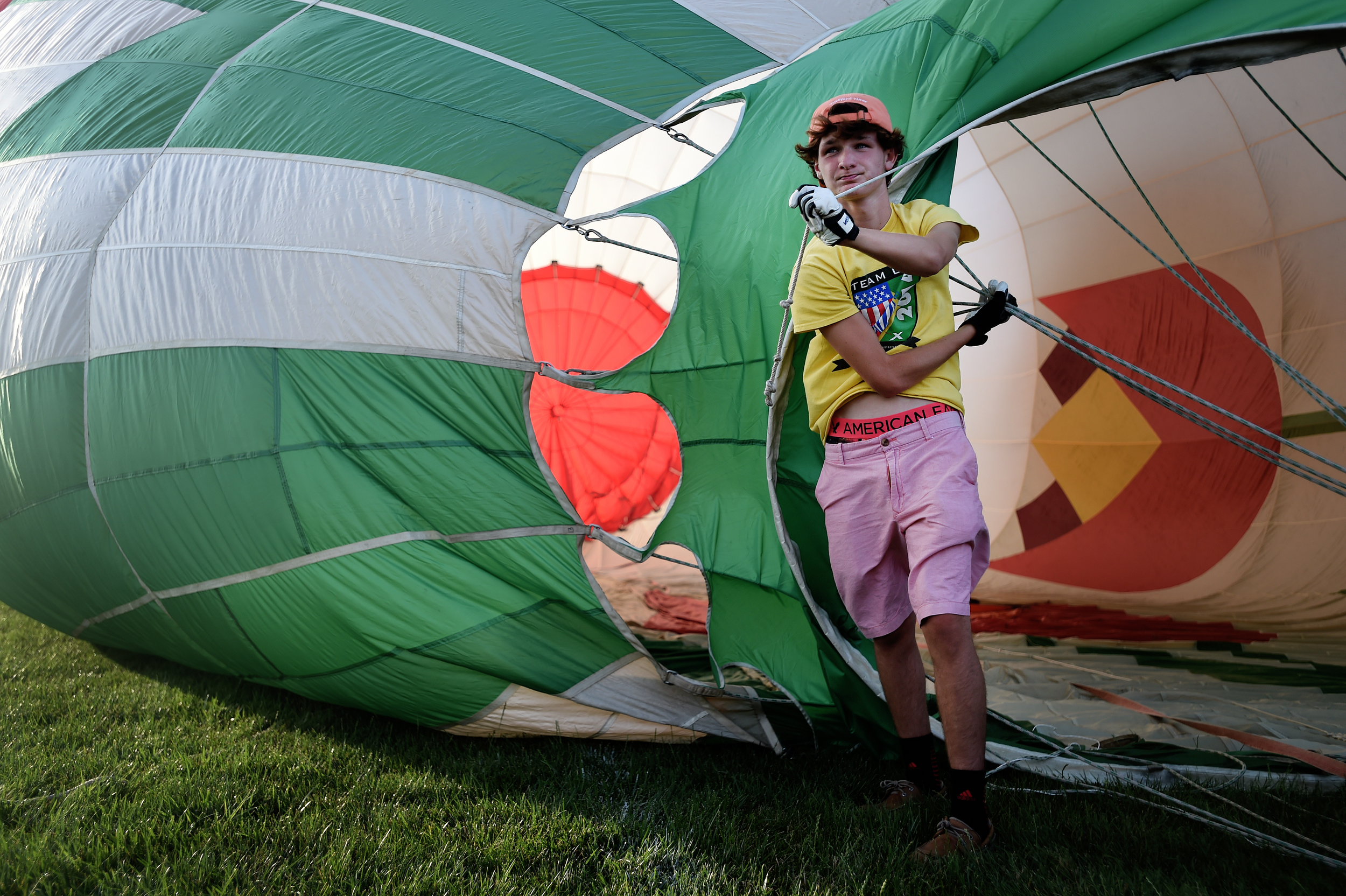 Christian Stison, 14, of Louisville, KY, helps inflate a hot air balloon during the Great Eastern Balloon Camp at Kutztown University in Kutztown, PA, on July 11, 2016. (Reading Eagle: Sarah Stier)