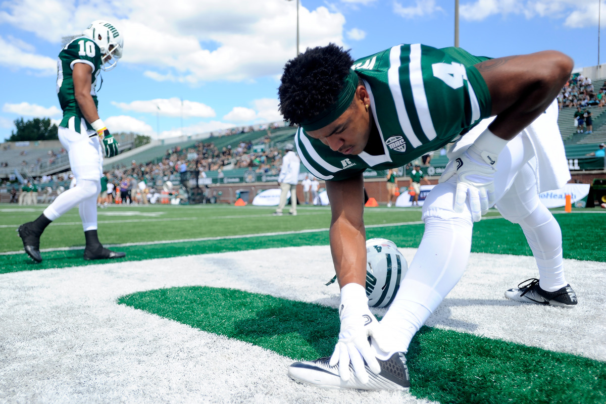 Ohio's sophomore running back Papi White stretches before the game against Texas State on September 3, 2016, in Athens, Ohio. After a back and forth game that went into triple overtime, the Bobcats dropped the game to Texas State 56-54.