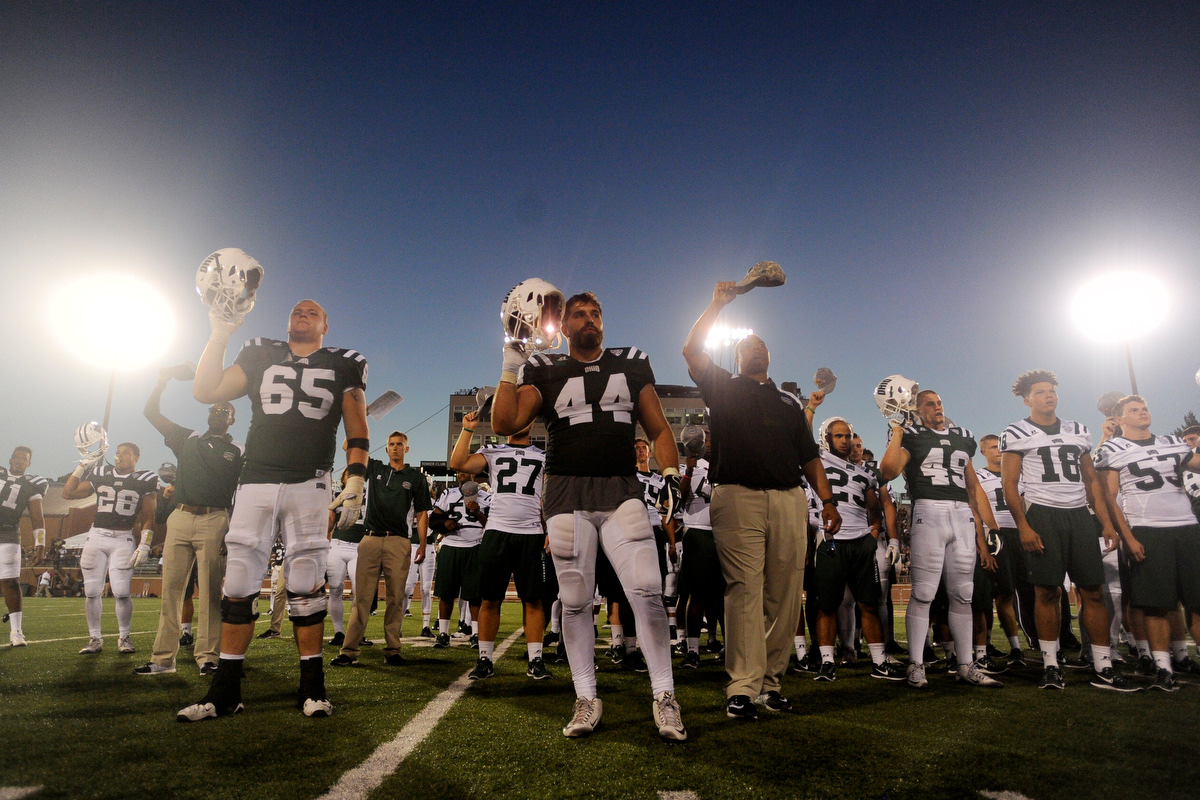 Ohio football players salute the band during the playing of the alma mater after the game against Texas State on September 3, 2016, in Athens, Ohio. After a back and forth game that went into triple overtime, the Bobcats dropped the game to Texas State 56-54.