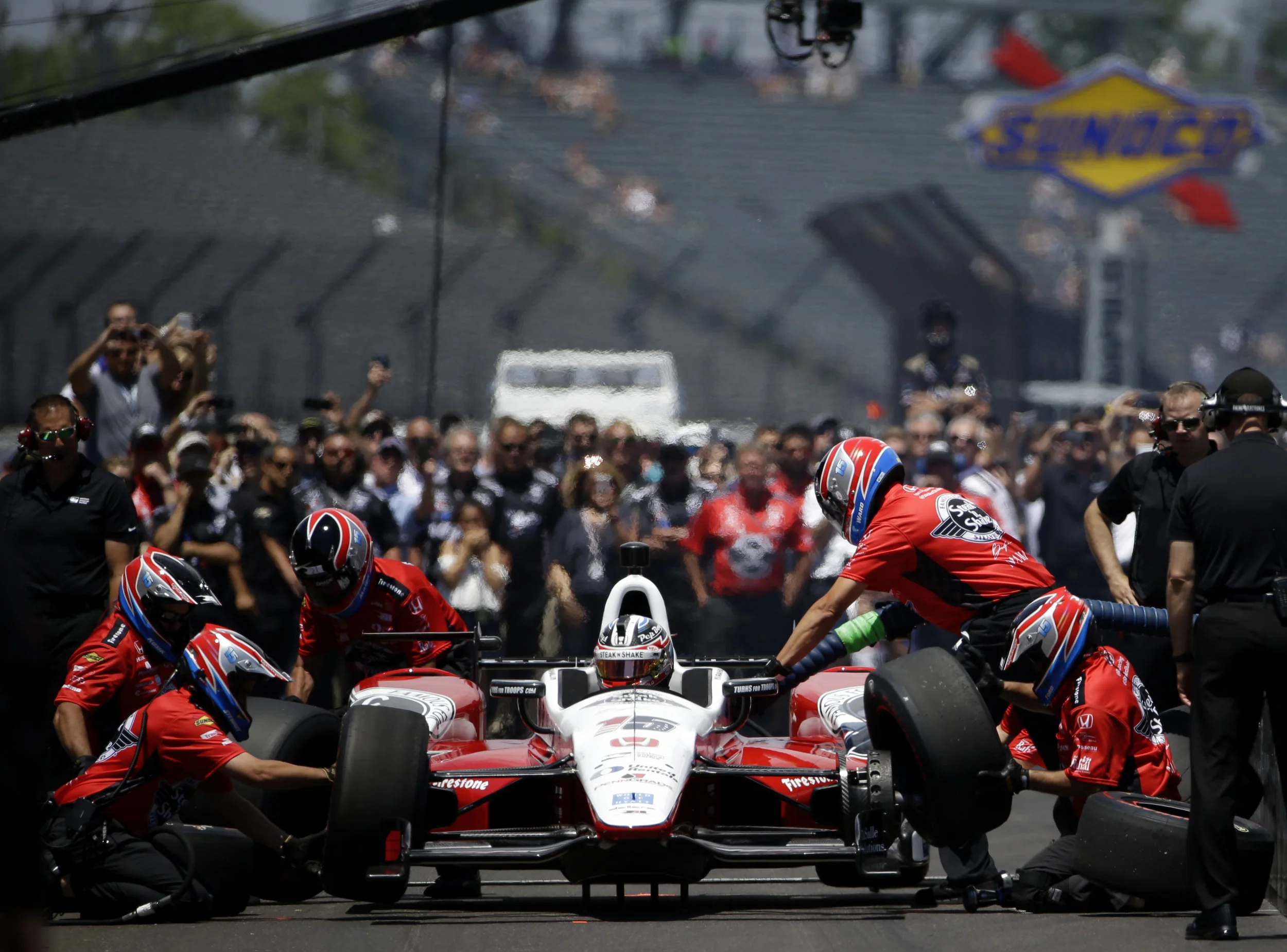 Crowds gather to watch as Graham Rahal's pit crew refuels and re-tires his car during the Indy 500 Pit Stop Challenge at Carb Day on Friday, May 26, 2017, for the 101st running of the Indy 500.