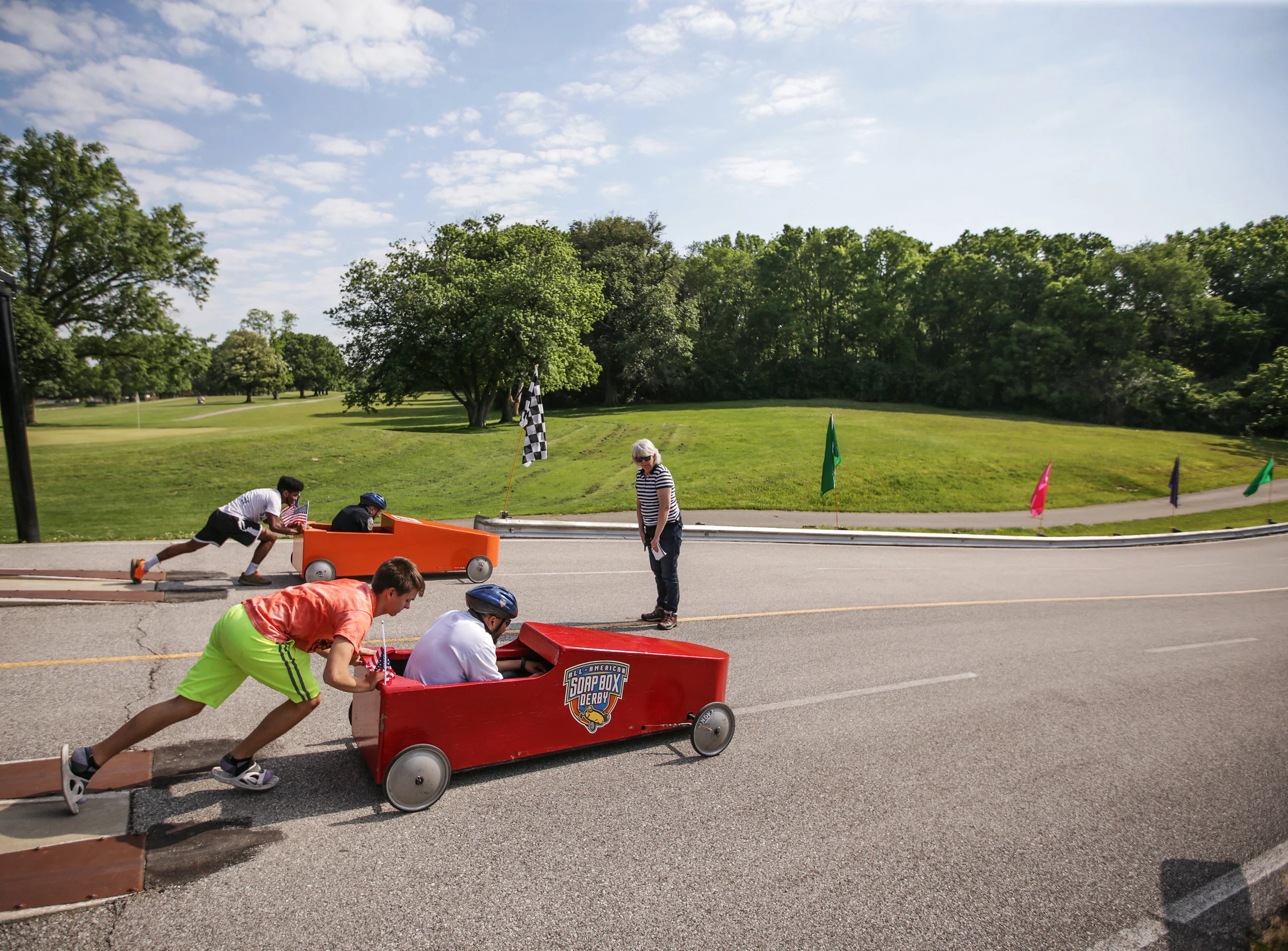 Henry Paul (left) pushes Deputy Mayor David Hampton down the derby hill during the 15th Annual Mayor's Cup on Saturday, June 3, 2017. The first few races of the day are "Celebrity Races" in which elected officials of the community participate in the races.