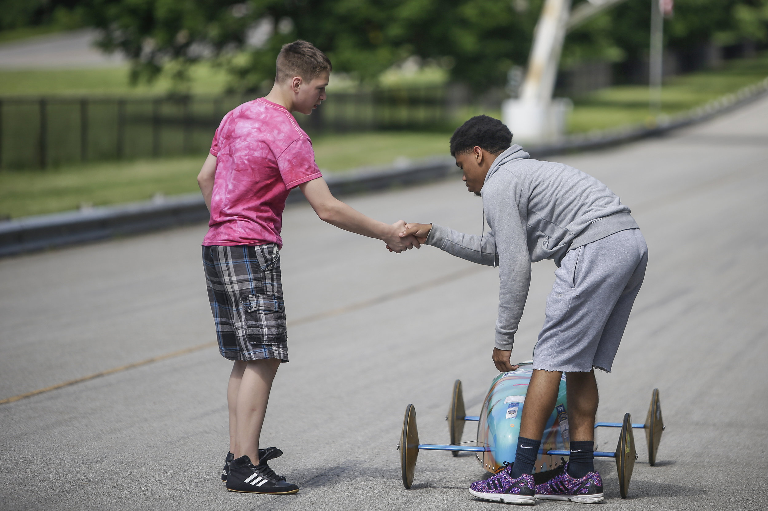 Joseph Flynn (left), 13, shakes his competitor, Geordan Wells', 16, hand after their race at the 15th Annual Mayor's Cup on Saturday, June 3, 2017.