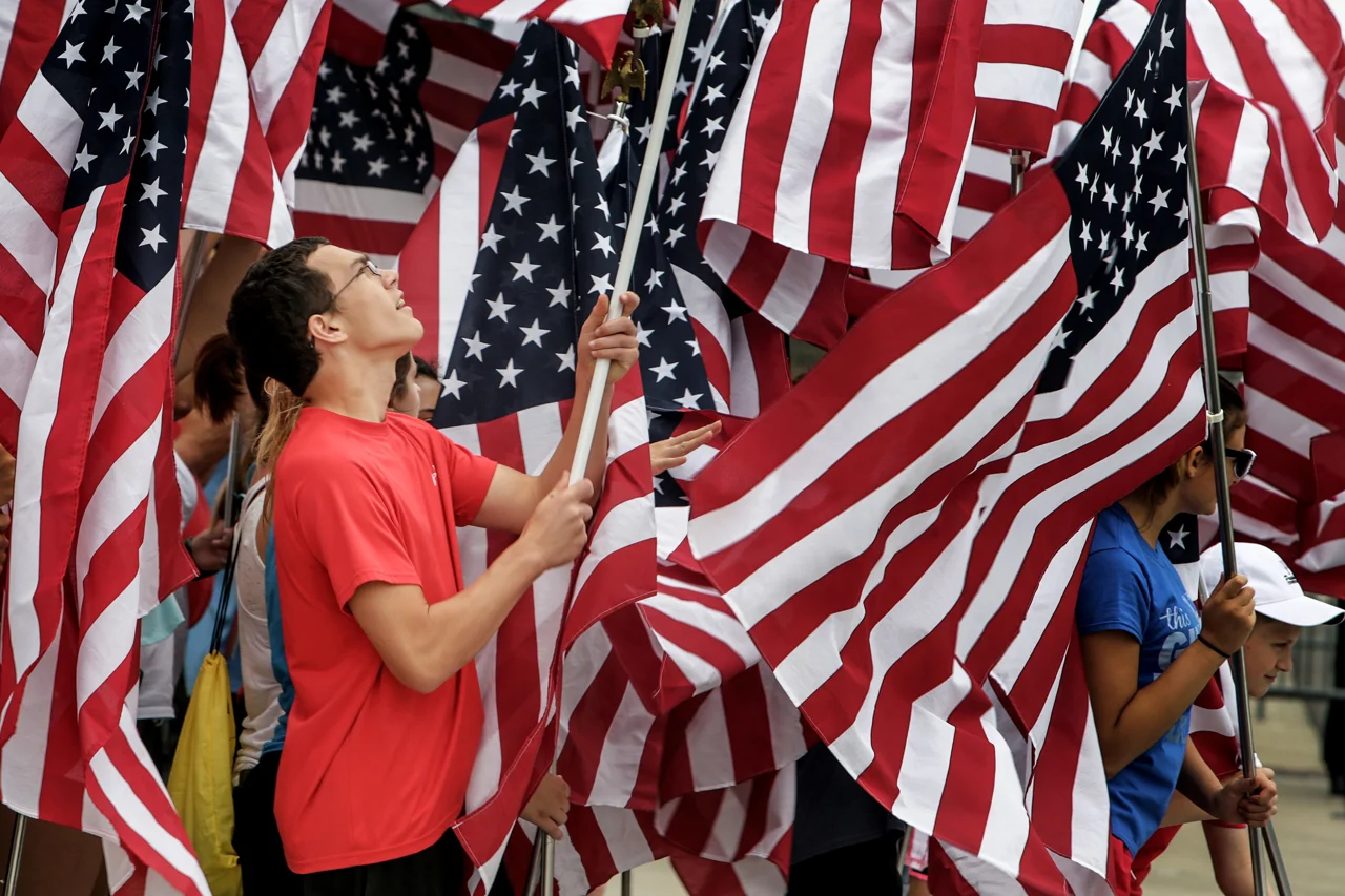Flags are hoisted into the air during the National Anthem at the SVRA Brickyard Vintage Race at Indianapolis Motor Speedway on Saturday, June 17, 2017.