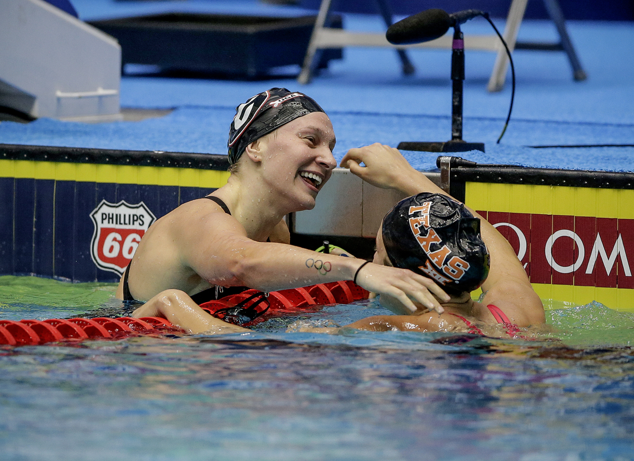 Madisyn Cox (right) congratulates Melanie Margalis (left) after Margalis won the 200-meter Individual Medley at the Phillips 66 National Championships at IUPUI Natatorium in Indianapolis on Saturday, July 1, 2017.