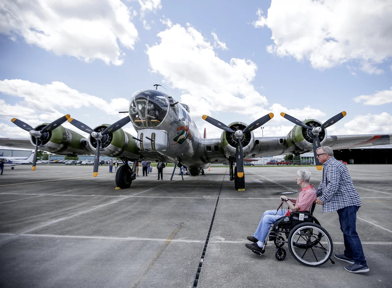 Rick Sutton (right) and his father, Dick Sutton, explore a historic B-17 bomber on Monday, June 26, 2017. The Liberty Foundations 2017 Salute to Veterans tour features flights on World War II-era Boeing B-17 Flying Fortress nicknamed 'Madras Maiden'. Dick Sutton is a Korean War veteran, and served in the military for 34 years.