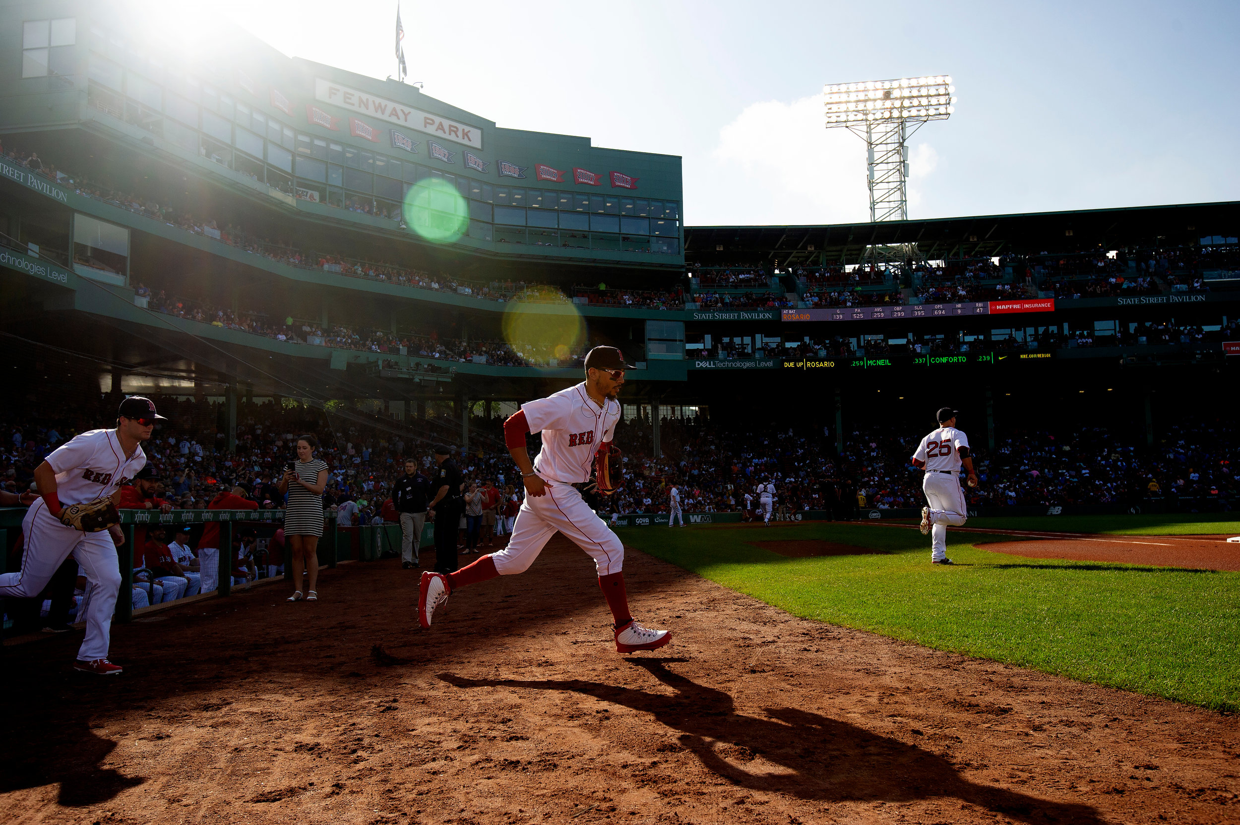  Boston Red Sox outfielder Mookie Betts runs onto the field at the start of the game against the New York Mets at Fenway Park in Boston, Massachusetts, on Saturday, September 15, 2018. 