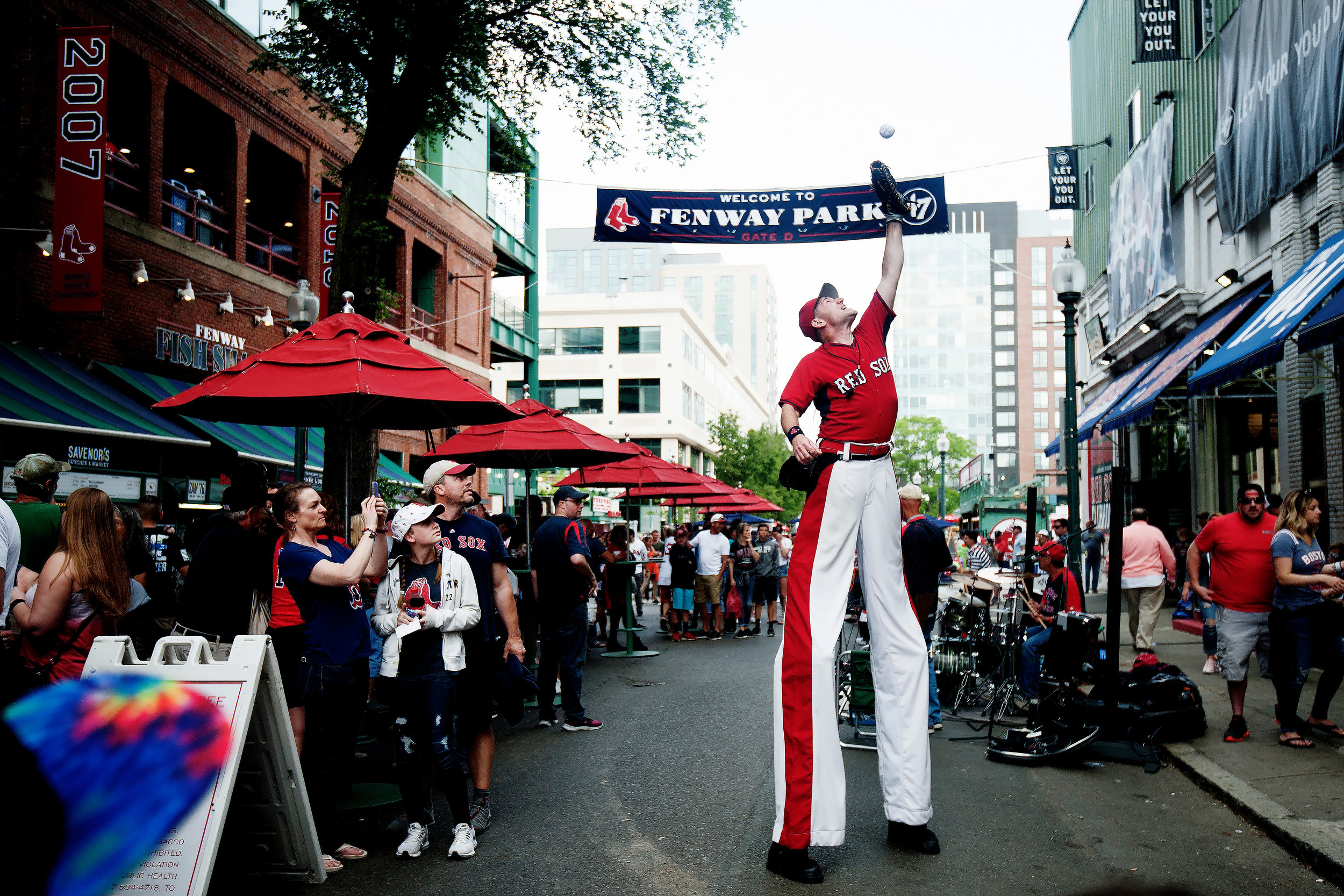  “Big League Brian” entertains a crowd gathering on Jersey Street before the game against Chicago White Sox at Fenway Park in Boston, Massachusetts on Friday, June 8, 2018. 