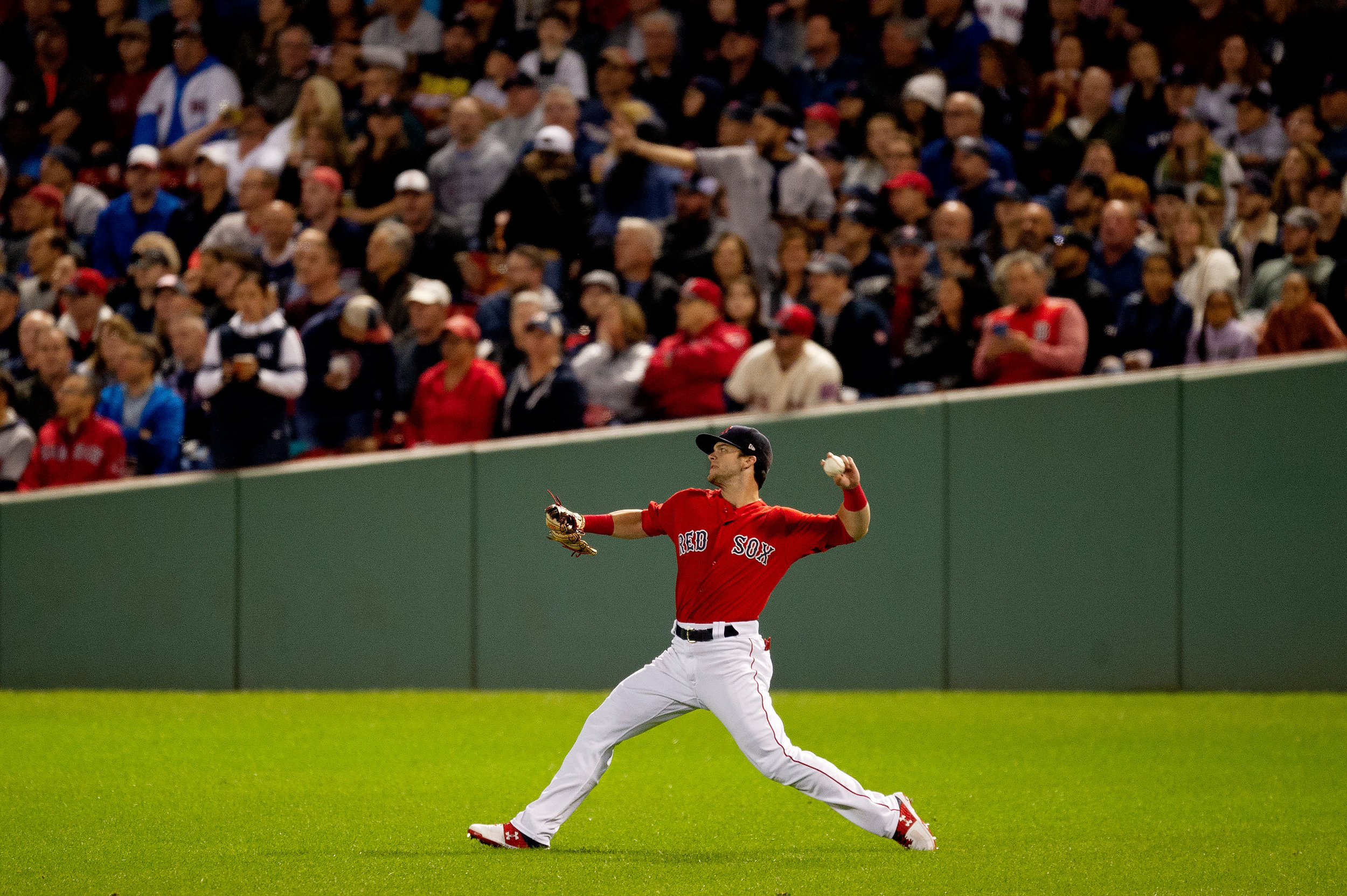  Boston Red Sox outfielder Andrew Benintendi throws from the outfield during the game against the New York Yankees at Fenway Park in Boston, Massachusetts, on Friday, September 28, 2018. 