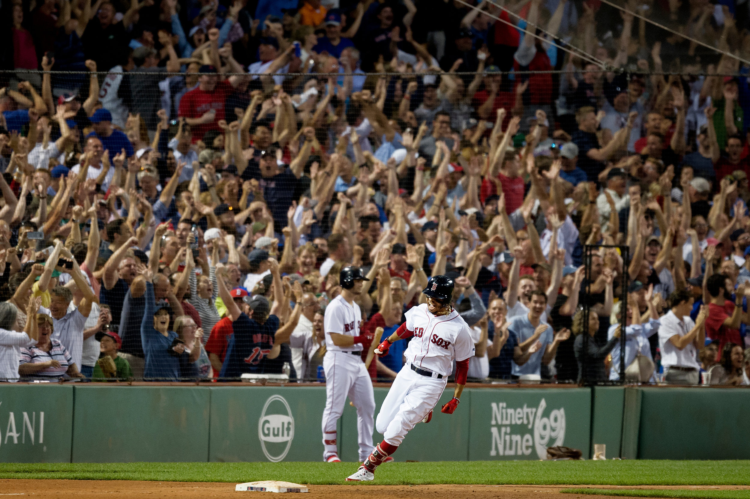  Boston Red Sox outfielder Mookie Betts rounds first base after hitting a grand slam during the game against the Toronto Blue Jays in Boston, Massachusetts on Thursday, July 12, 2018. The home run came after a 13-pitch at-bat. 