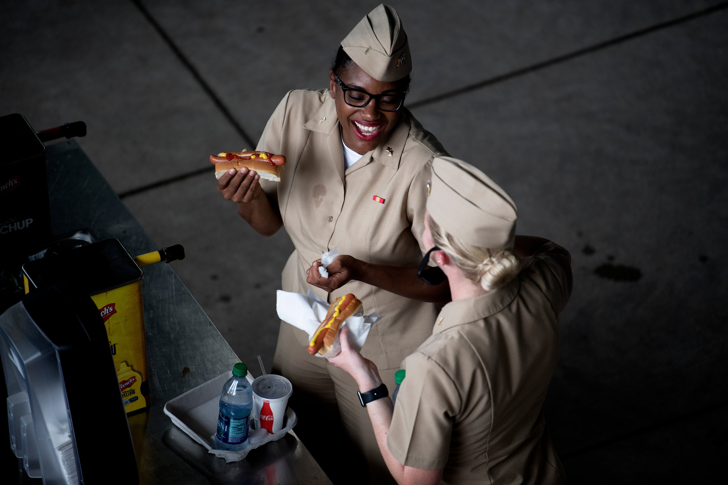  Fans converse over Fenway Franks during the game against the Atlanta Braves at Fenway Park in Boston, Massachusetts on Saturday, May 26, 2018. 