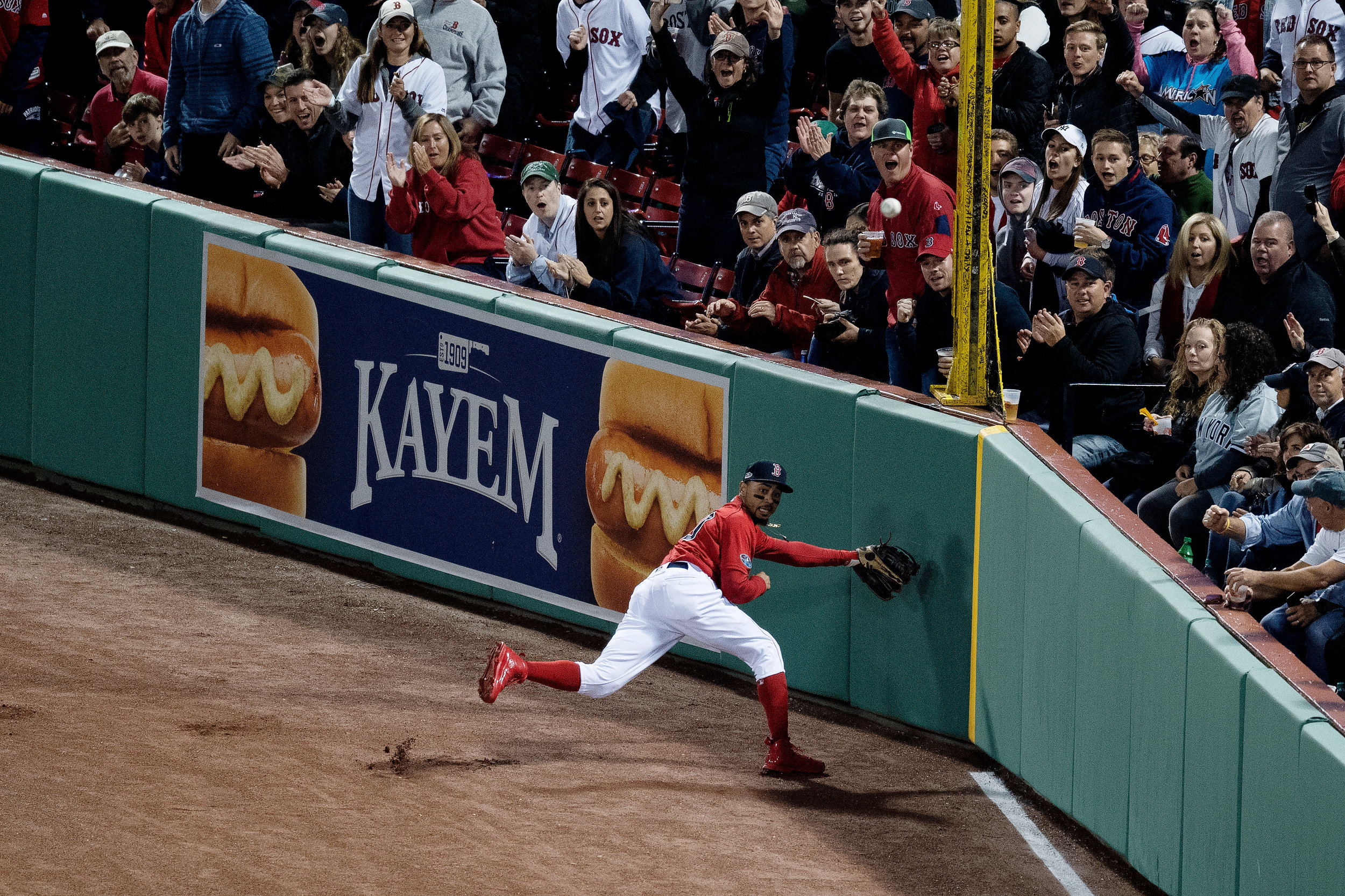  Boston Red Sox outfielder Mookie Betts looks to catch the ball in right field during Game 1 of the ALDS against the New York Yankees at Fenway Park in Boston, Massachusetts, on Friday, October 5, 2018. 