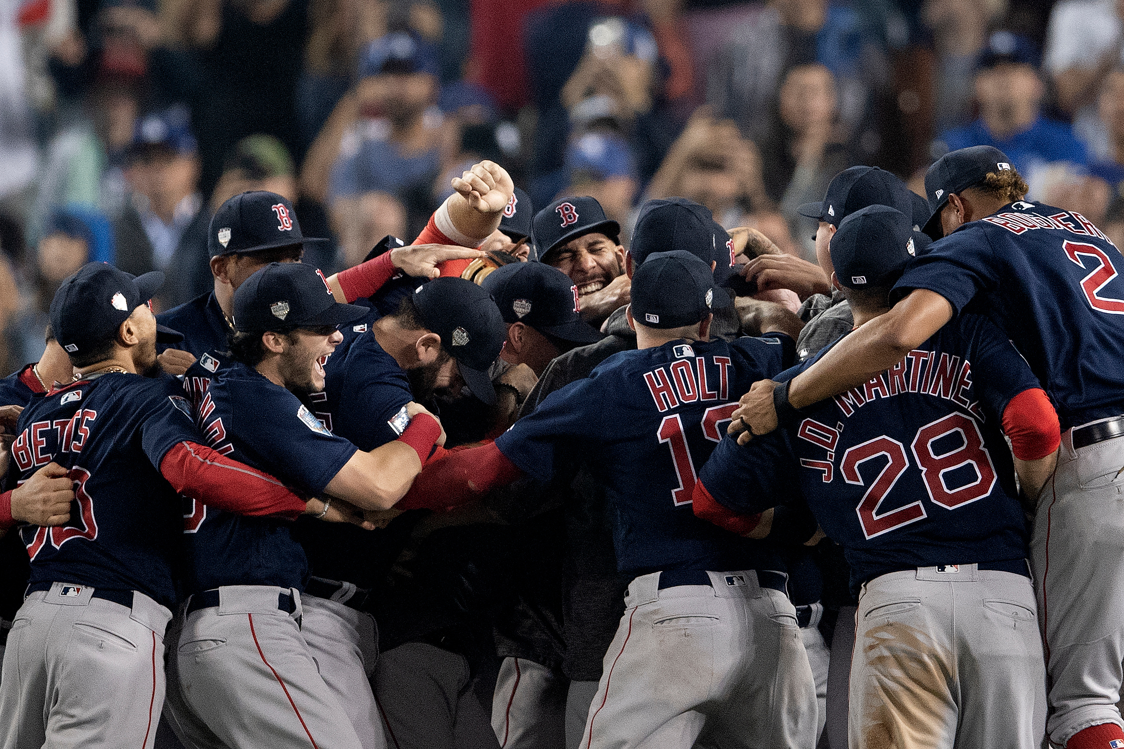  Members of the Boston Red Sox react after the final out was recorded to win the 2018 World Series in game five against the Los Angeles Dodgers at Dodger Stadium on Sunday, October 28, 2018. 
