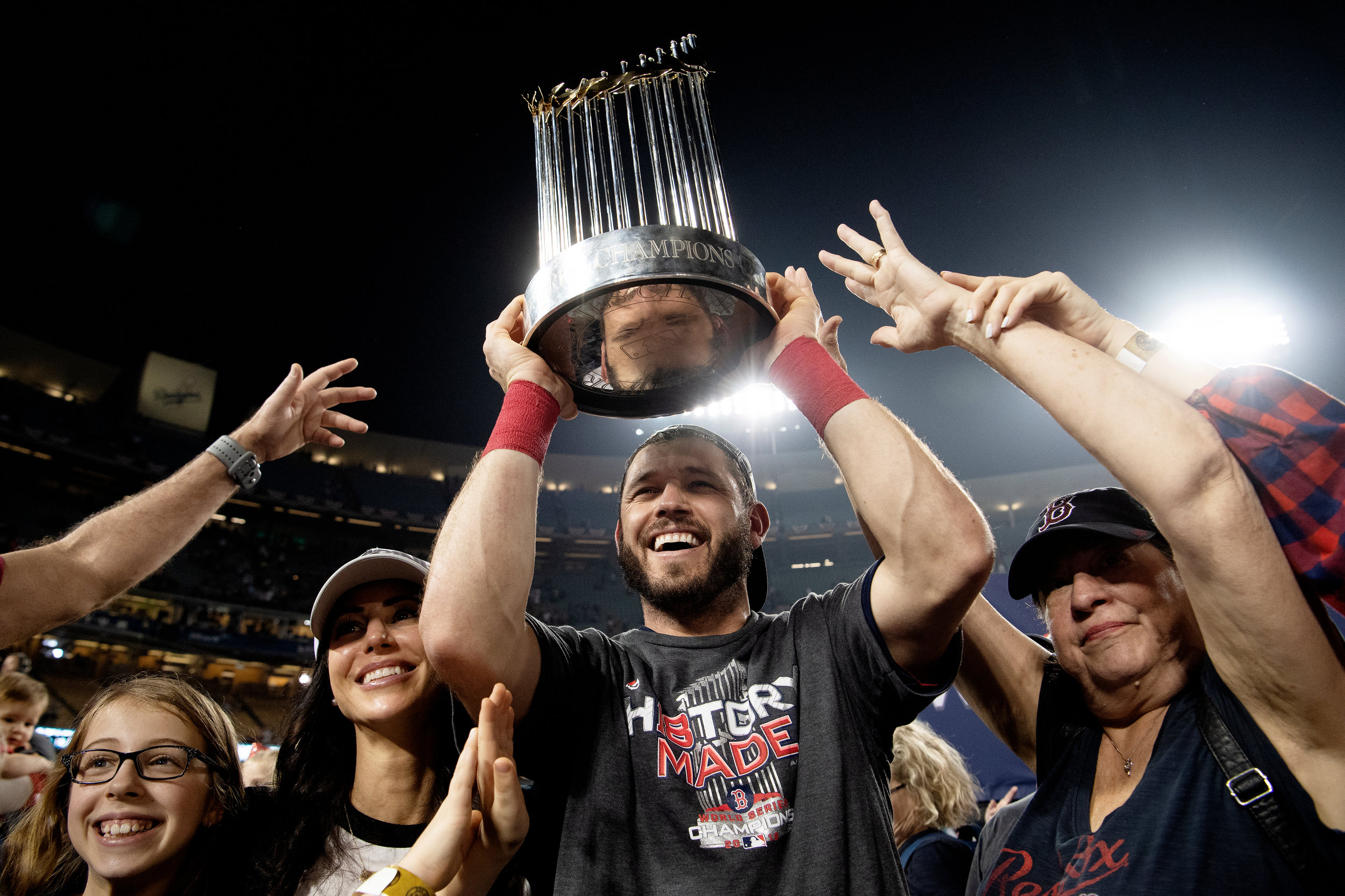  Boston Red Sox second baseman Ian Kinsler hoists the trophy over his head after winning Game 5 of the World Series versus Los Angeles Dodgers at Dodger Stadium on Sunday, October 28, 2018. 