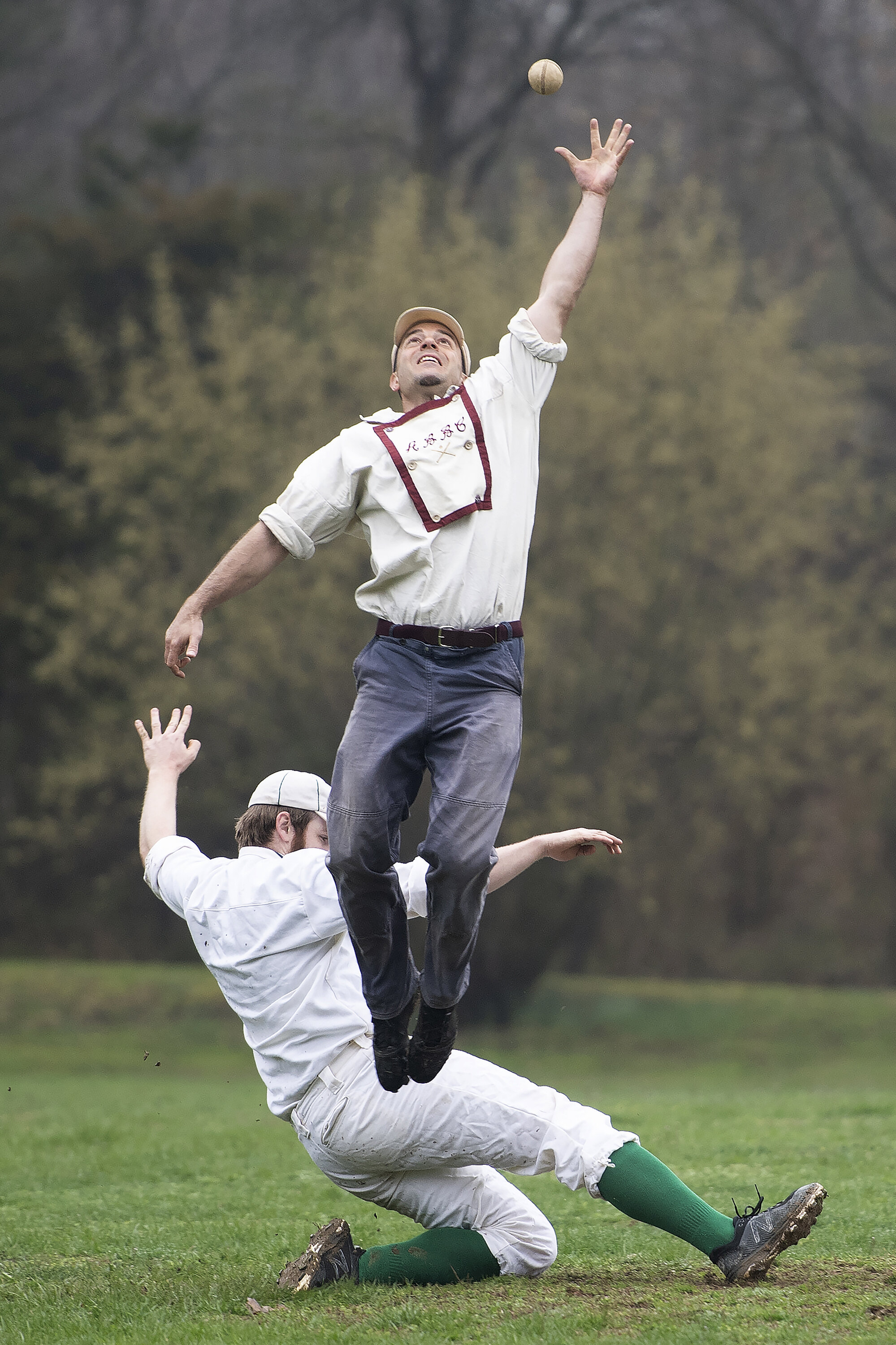  Sean "Toothpick" Ness of the Brooklyn Atlantics leaps into the air to make an out on Derek Fesolowich of the New York Mutuals at second base during the game at Old Bethpage Village Restoration on April 13, 2019 in Old Bethpage, NY. In 1864, players 