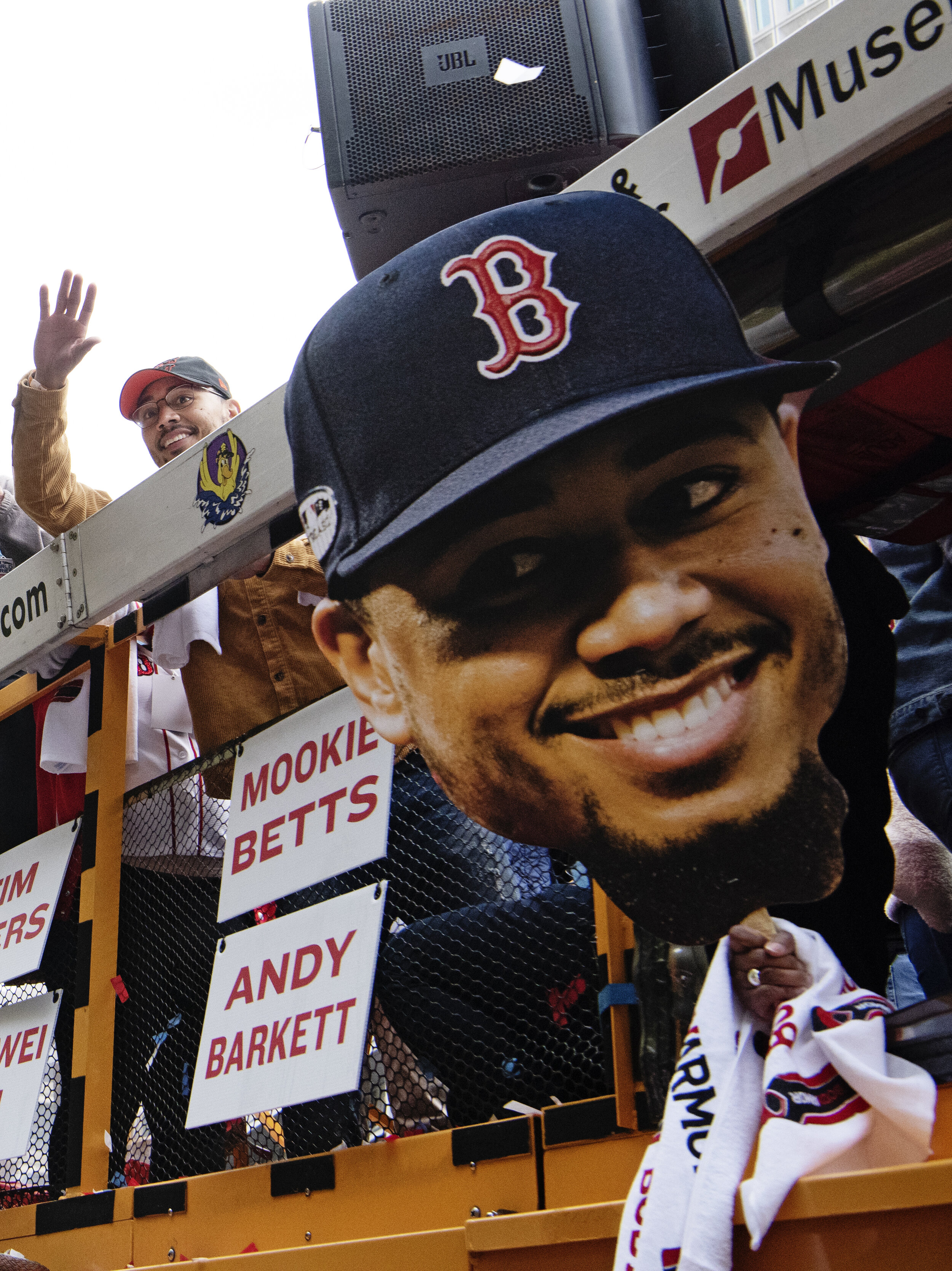  Mookie Betts #50 of the Boston Red Sox waves to crowds gathered in downtown Boston, Massachusetts, for the World Series Champions parade on October 31, 2018. 