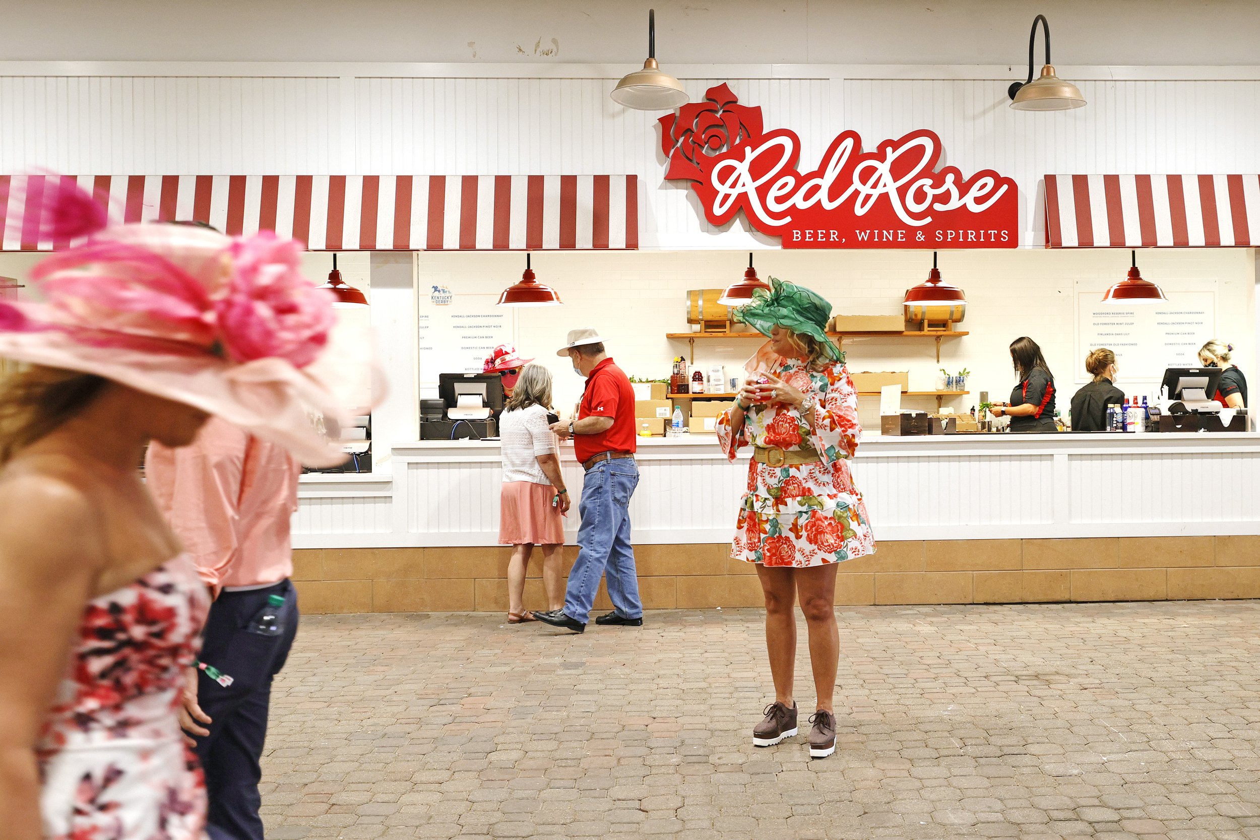  A race fan holds a drink outside of a concession stand prior to the 2021 Kentucky Oaks at Churchill Downs on April 30, 2021 in Louisville, Kentucky. 