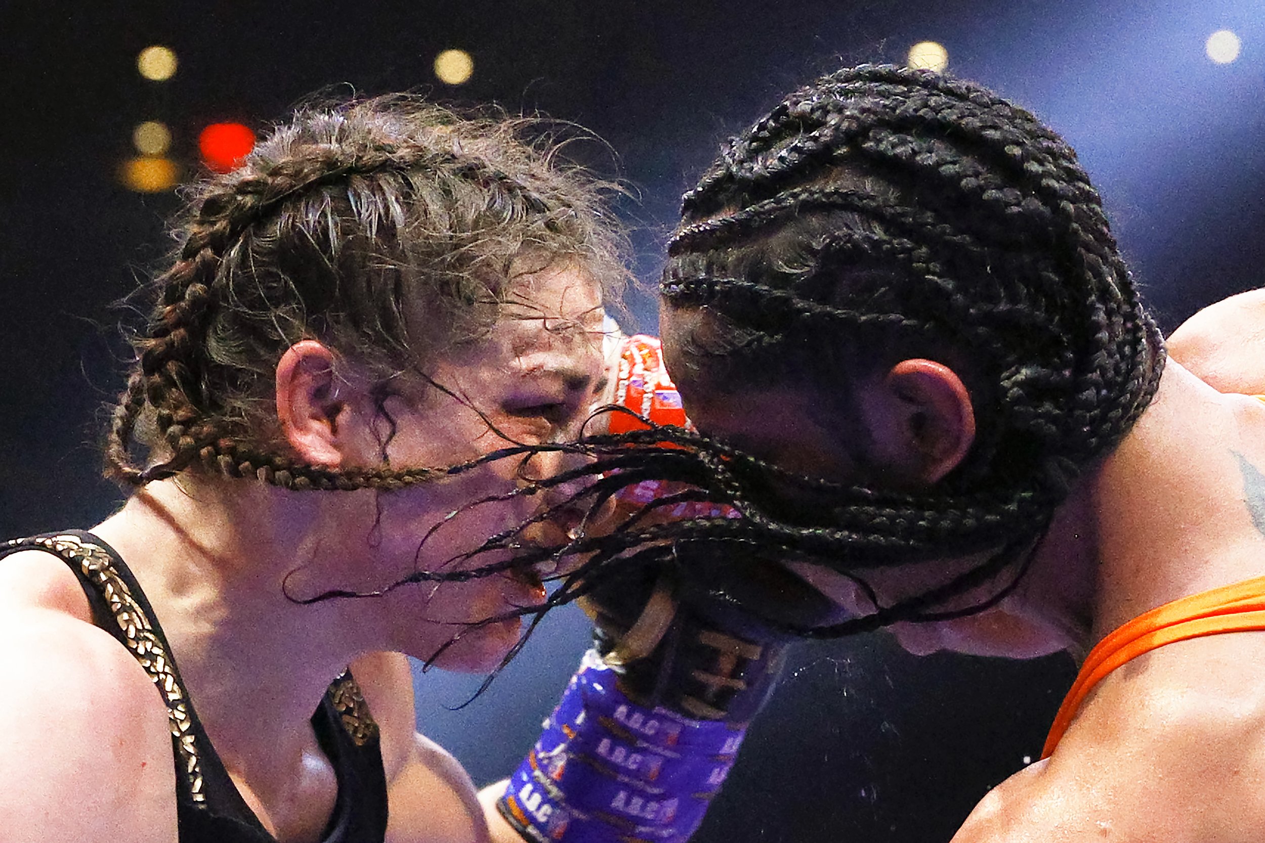  Katie Taylor of Ireland (L) trades punches with Amanda Serrano of Puerto Rico (R) for the World Lightweight Title fight at Madison Square Garden on April 30, 2022 in New York, New York. This bout marks the first women’s boxing fight to headline Madi