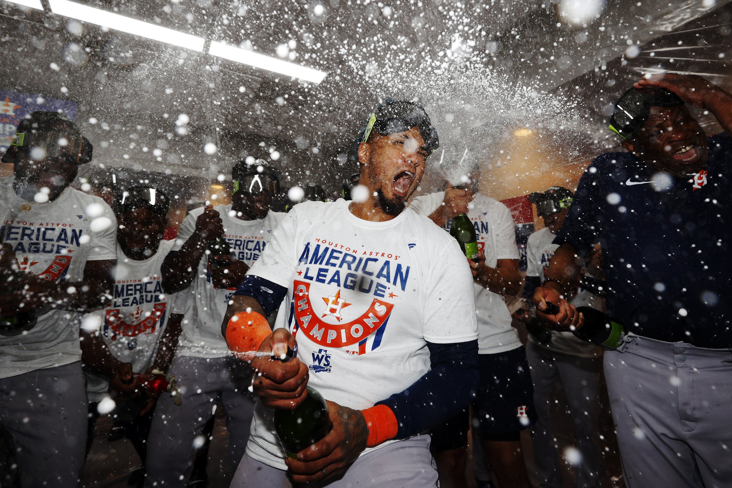  Martin Maldonado #15 of the Houston Astros celebrates with manager Dusty Baker in the locker room after defeating the New York Yankees 6-5 in game four of the American League Championship Series to advance to the World Series at Yankee Stadium on Oc