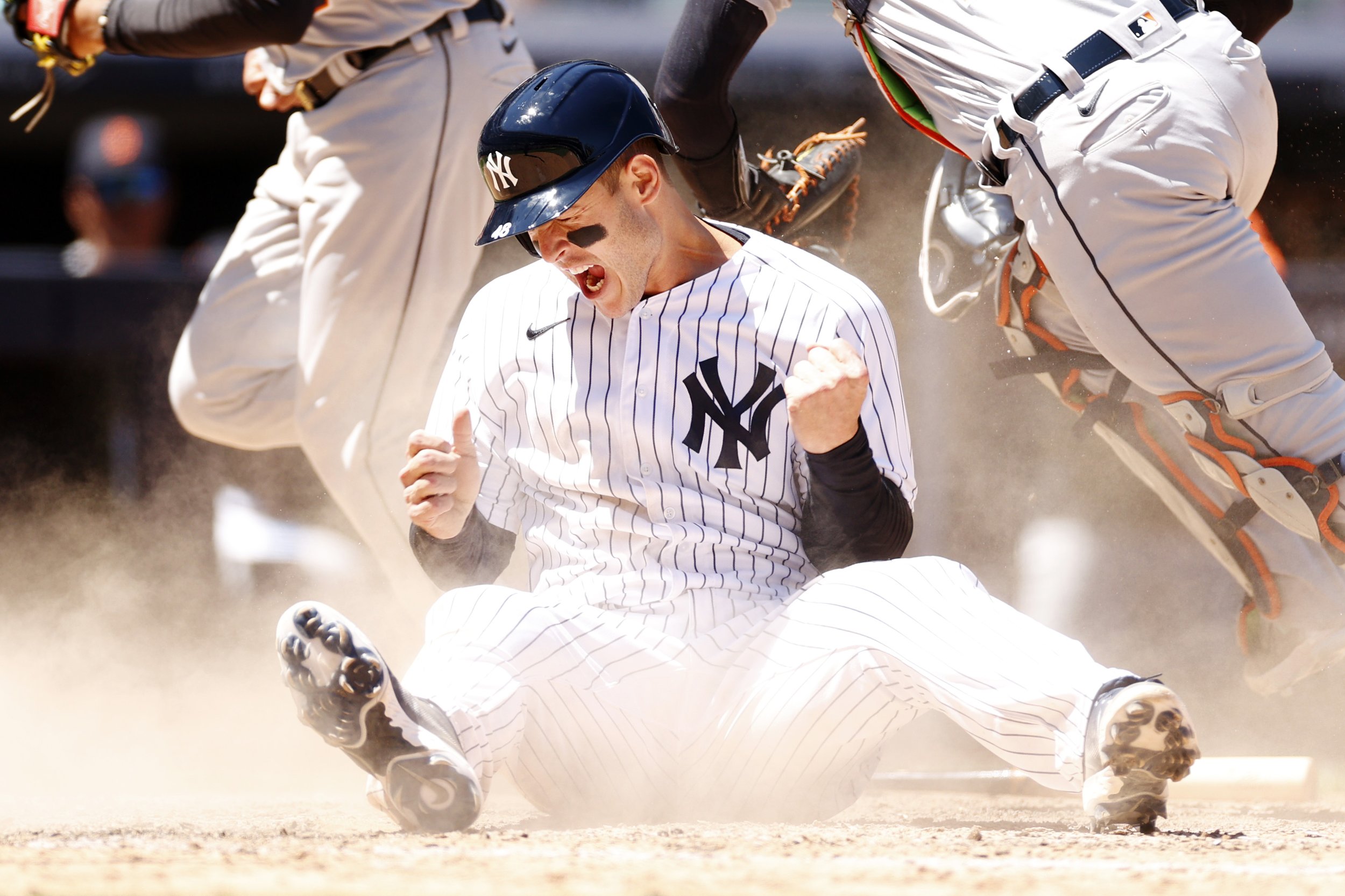  Anthony Rizzo #48 of the New York Yankees reacts after sliding safely into home to score on an error and tie the game during the eighth inning against the Detroit Tigers at Yankee Stadium on June 05, 2022 in the Bronx borough of New York City.  