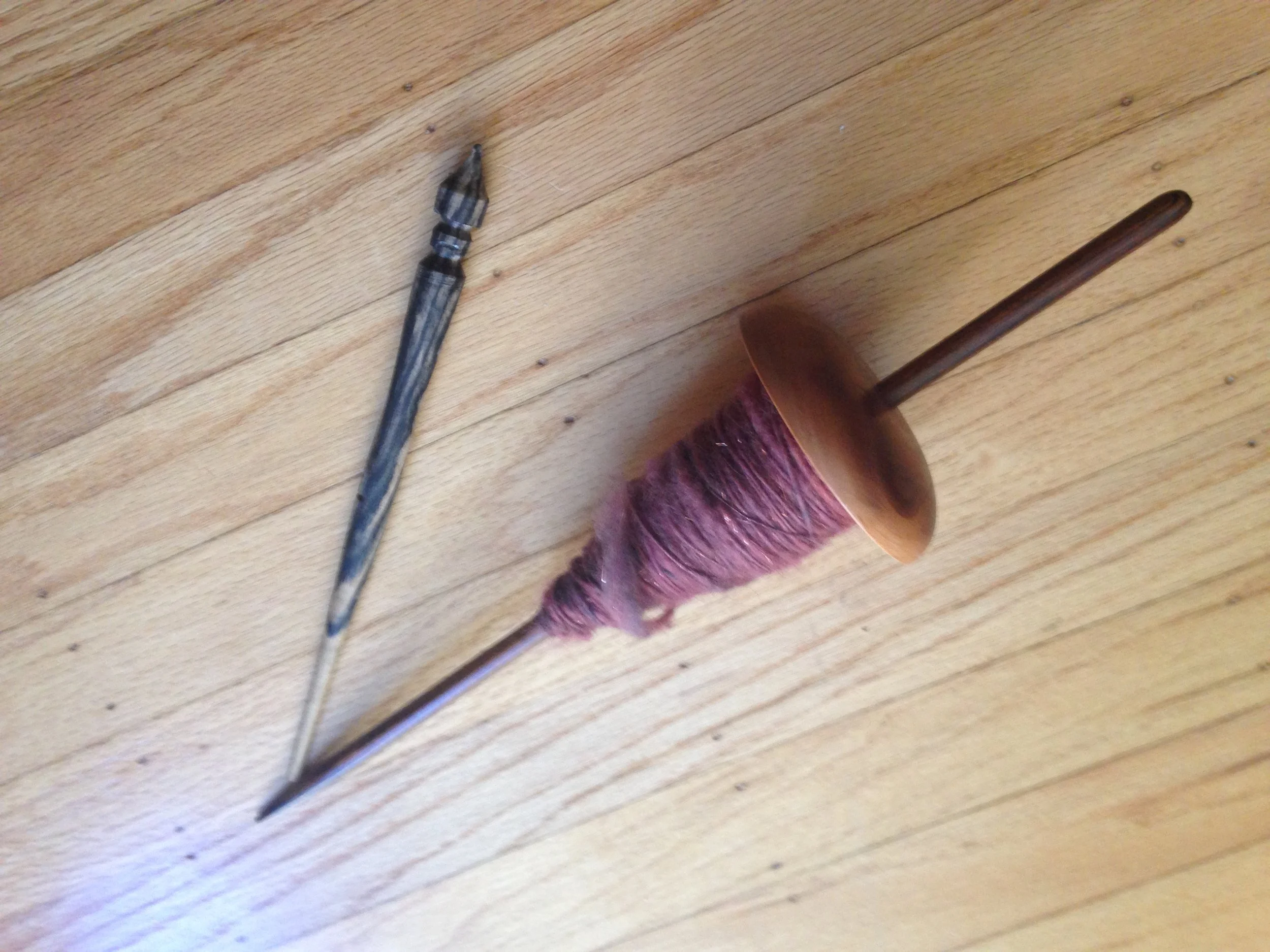 Supported spindles. Navajo spindle with cop.