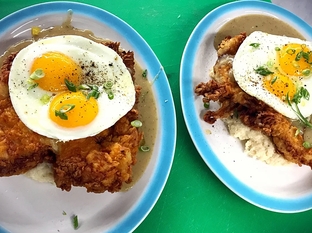 Mels Diner. Chicken fried chicken, cheesy Grits, and two eggs sunny side up.