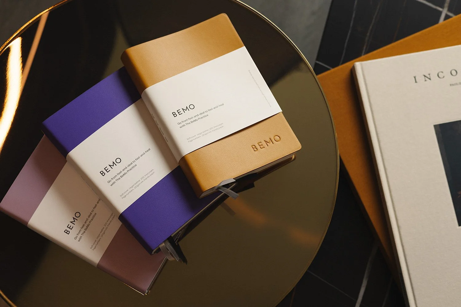  Professional product photography of BEMO luxury journals and stationery. This high-angle flat lay captures the minimalist design and rich textures of premium paper goods, showcasing Phillip Istomin’s expertise in commercial brand storytelling and pr