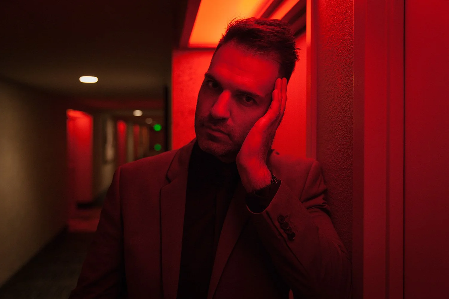  Cinematic editorial portrait showcasing MANICPROJECT’s mastery of mood and atmosphere through dramatic red lighting and the subtle art of illusion in Salt Lake City 