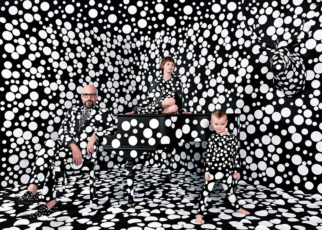  Immersive high-concept family portrait with custom patterned set design demonstrating MANICPROJECT’s expertise in bringing complex and otherworldly fantasy ideas to life in Salt Lake City 