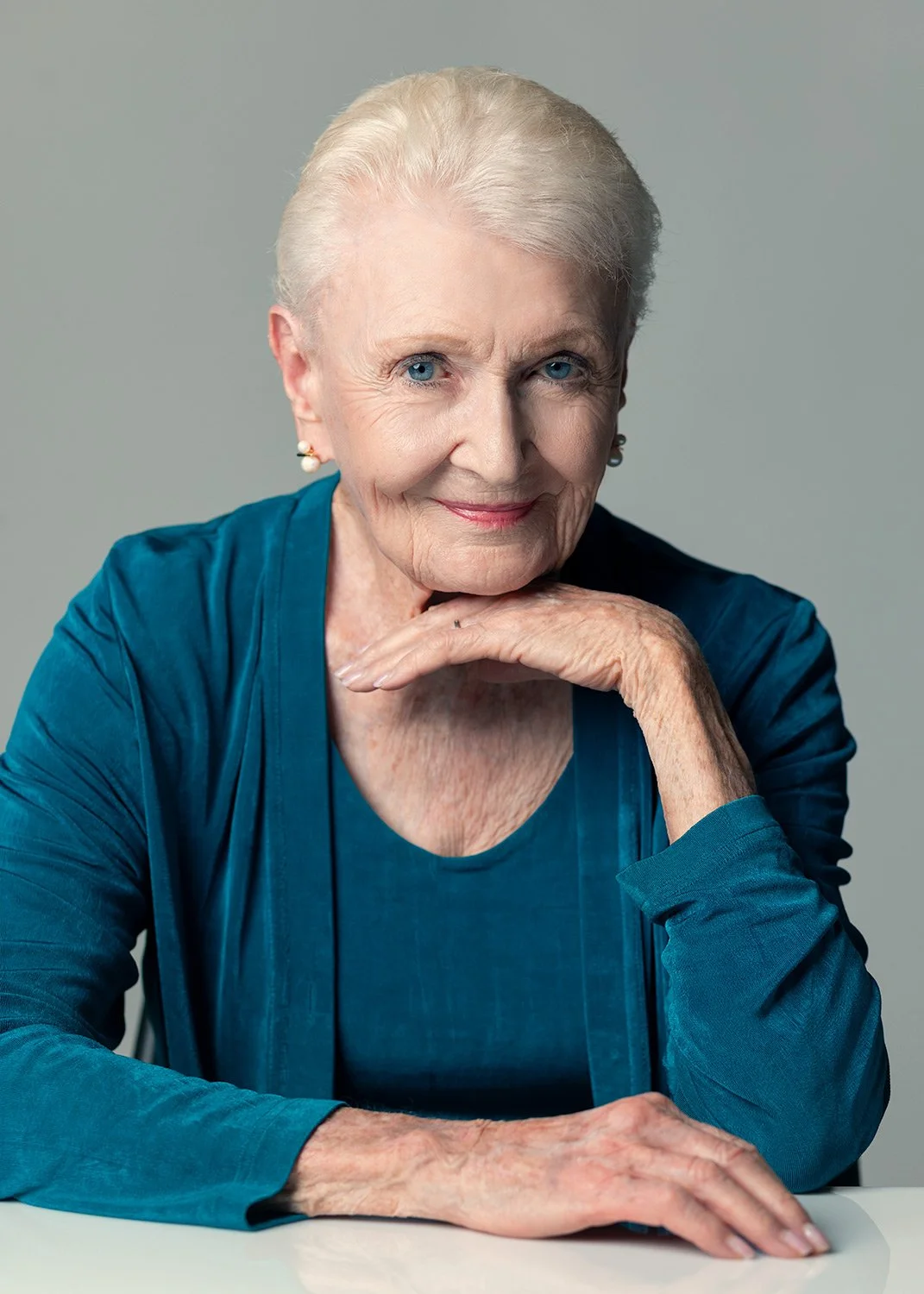  Editorial studio portrait of legendary model and actress Pat Carr, represented by TMG Talent (The Agency Group). High-contrast studio portraiture capturing classic elegance and sophisticated talent representation 