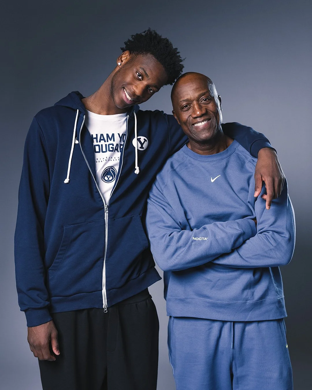 Candid studio portrait of AJ Dybantsa with his father, Ace Dybantsa, for Sports Illustrated. Magazine-worthy photography by MANICPROJECT capturing the supportive family dynamic behind the top NBA prospect