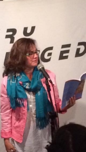 Reading at Poetry Unplugged in London, May, 2015 just days before the crisis year began.