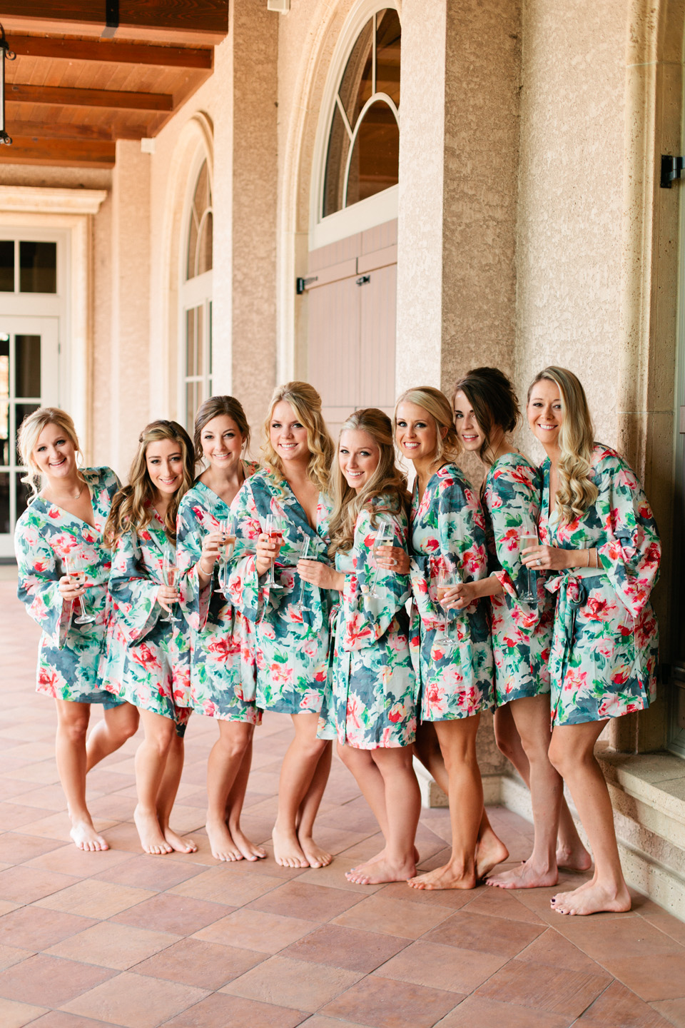 Picture of bridesmaids in floral robes getting ready for a wedding day at TPC Sawgrass in Ponte Vedra, Florida