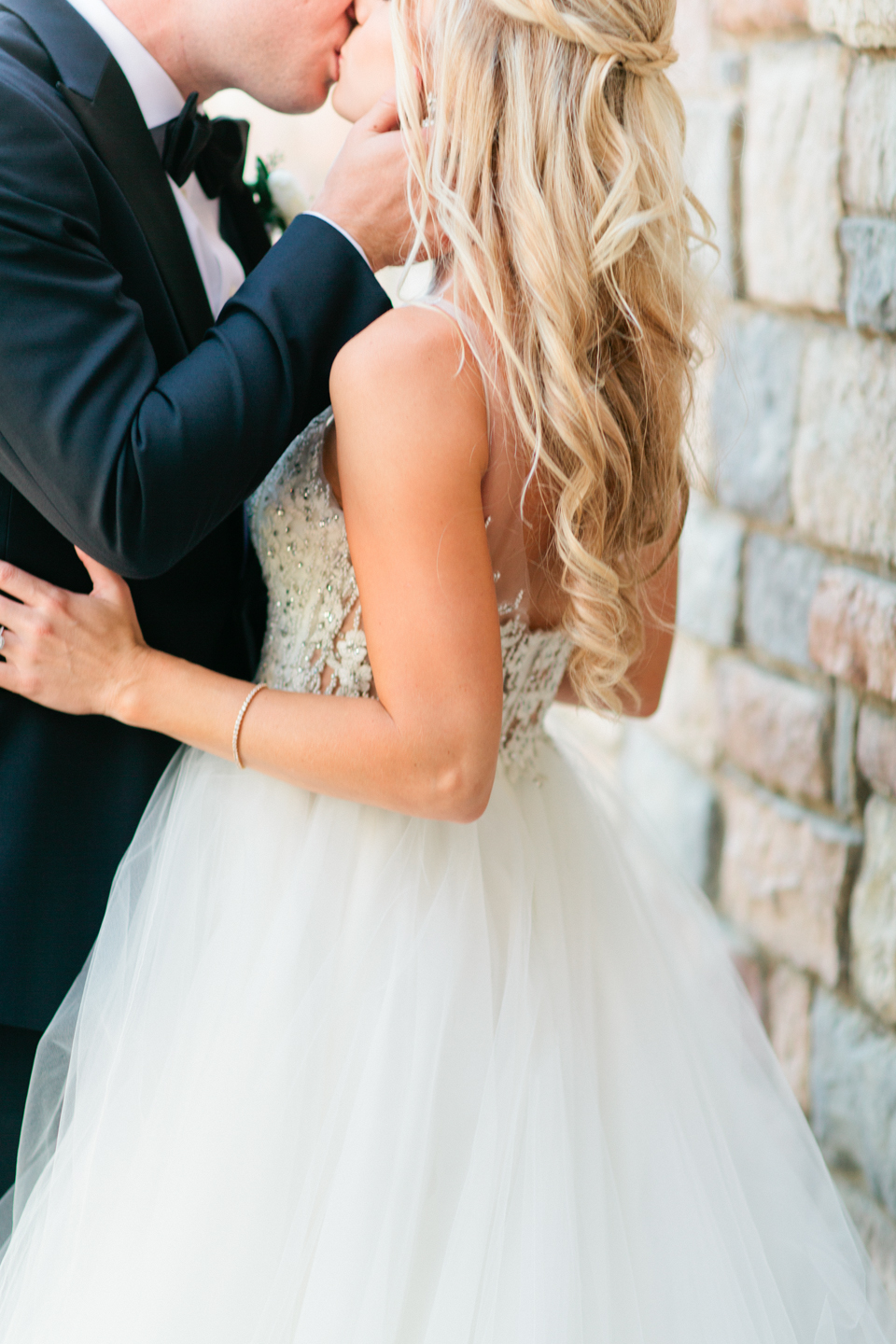 Image of a groom kissing his bride on their wedding day at TPC Sawgrass in Ponte Vedra, Florida