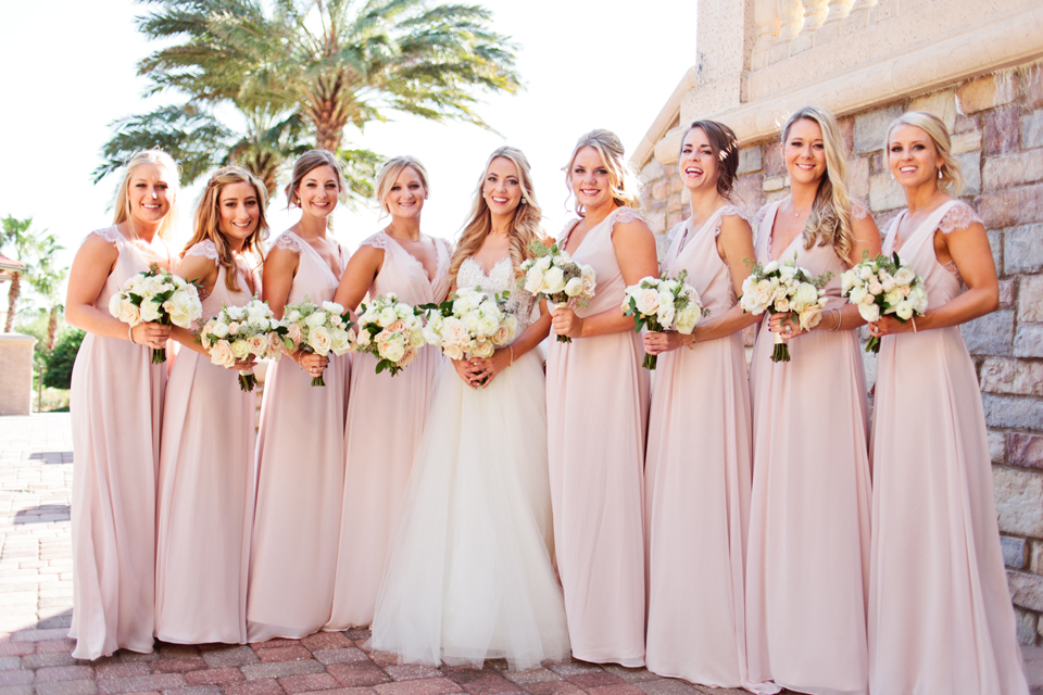 Picture of a bride and her bridesmaids with their bouquets.  The wedding is at TPC Sawgrass in Ponte Vedra, Florida