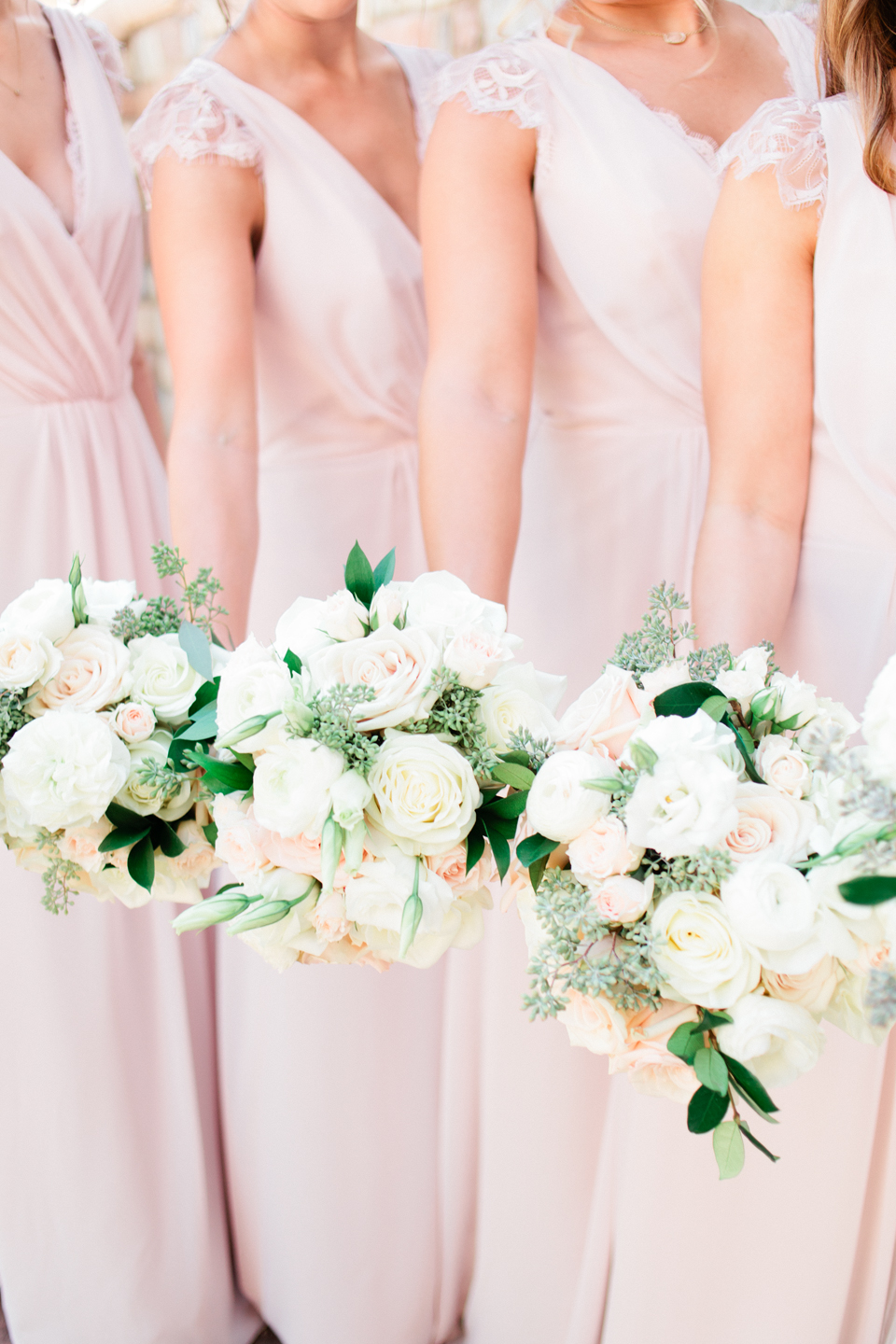 Image of bridesmaids holding their bouquets on the wedding day at TPC Sawgrass in Ponte Vedra, Florida