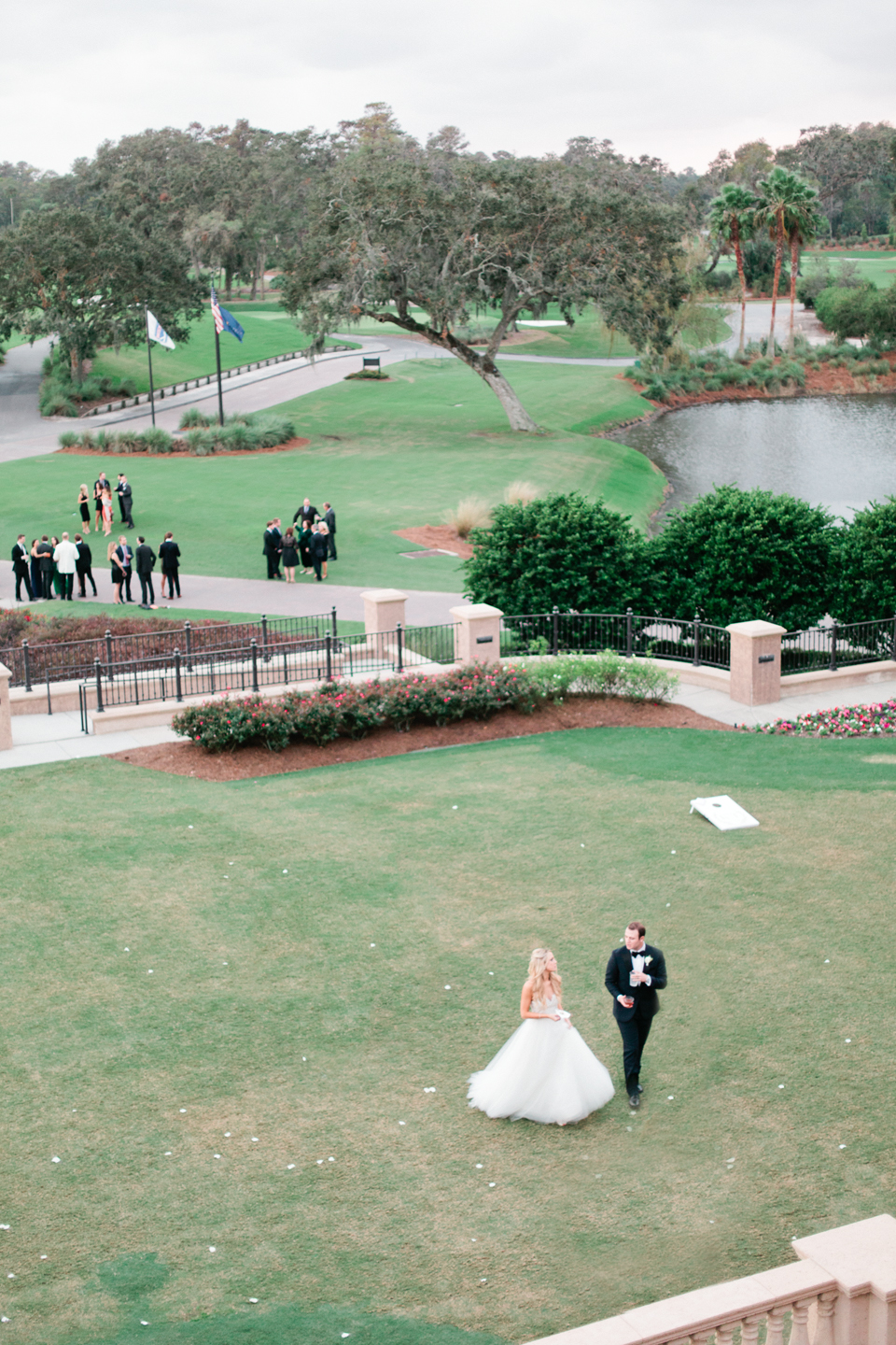 Image of a bride and groom walking the green at TPC Sawgrass in Ponte Vedra, Florida