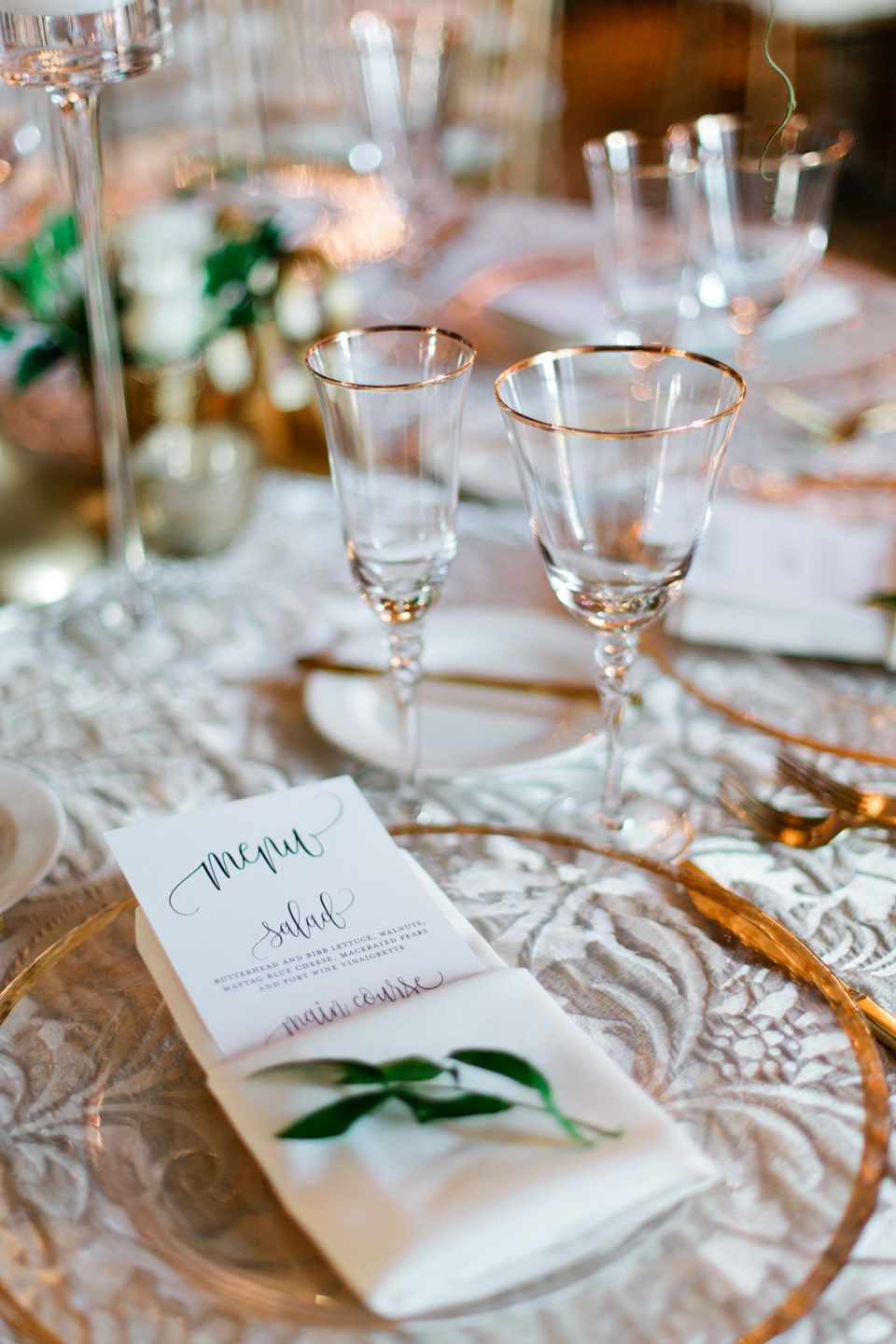 Image of a place setting at a wedding reception with gold utensils at TPC Sawgrass in Ponte Vedra, Florida