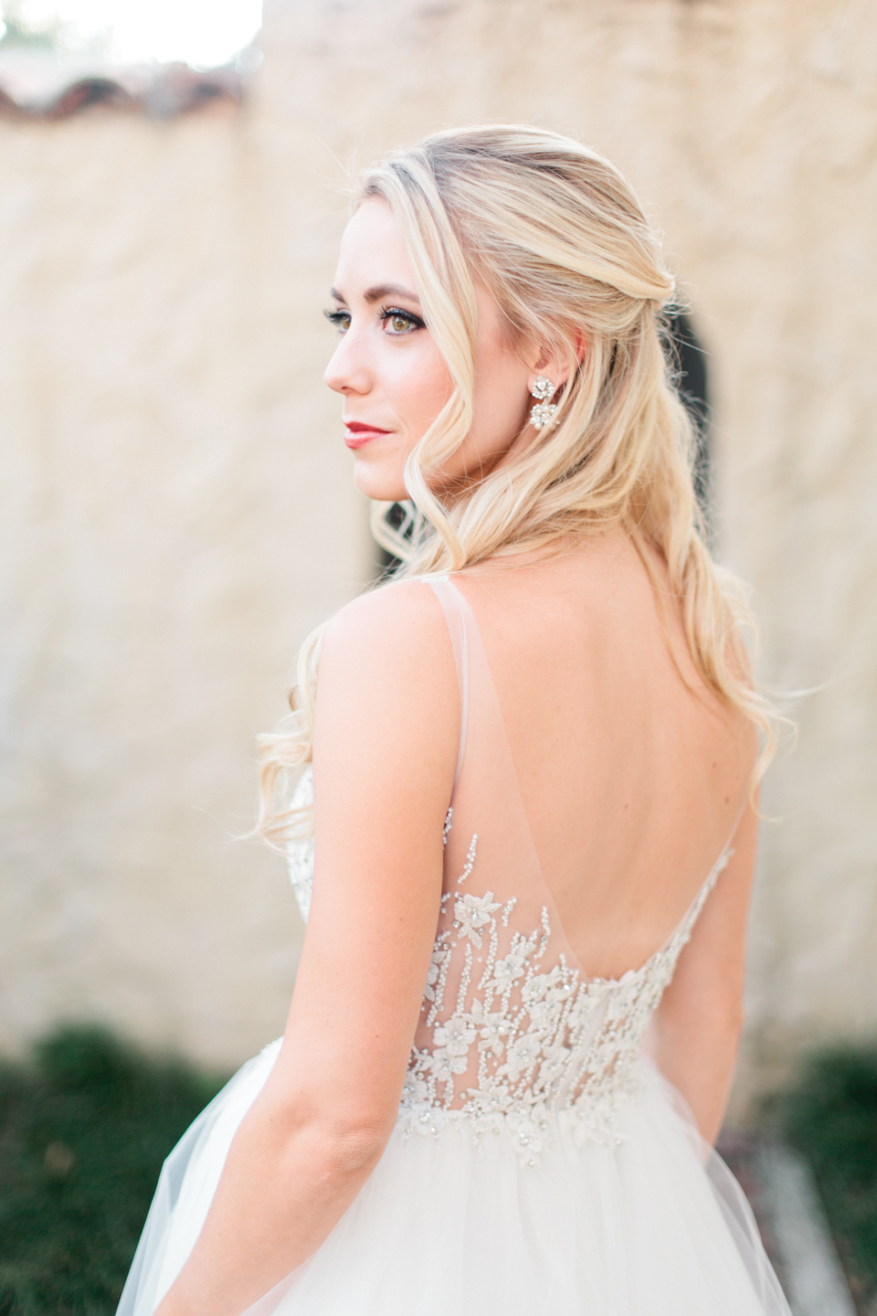 Bride in a Calvet Couture wedding gown with long curled hair at Epping Forest Yacht Club in Jacksonville, Florida