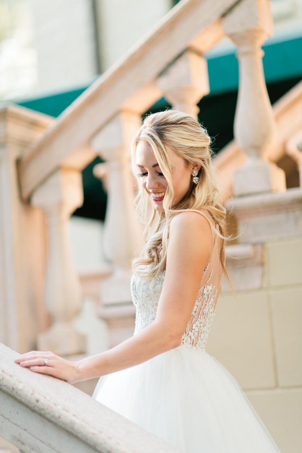 Image of a bride in a wedding Calvet Couture wedding gown at the Epping Forest Yacht Club in Jacksonville Florida.  She is on a staircase.