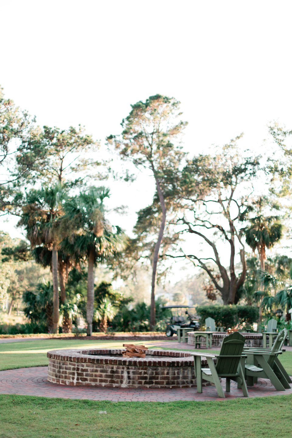 Picture of a brick fire pit with cobblestone sidewalk around it in coastal South Carolina Montage Palmetto Bluff.