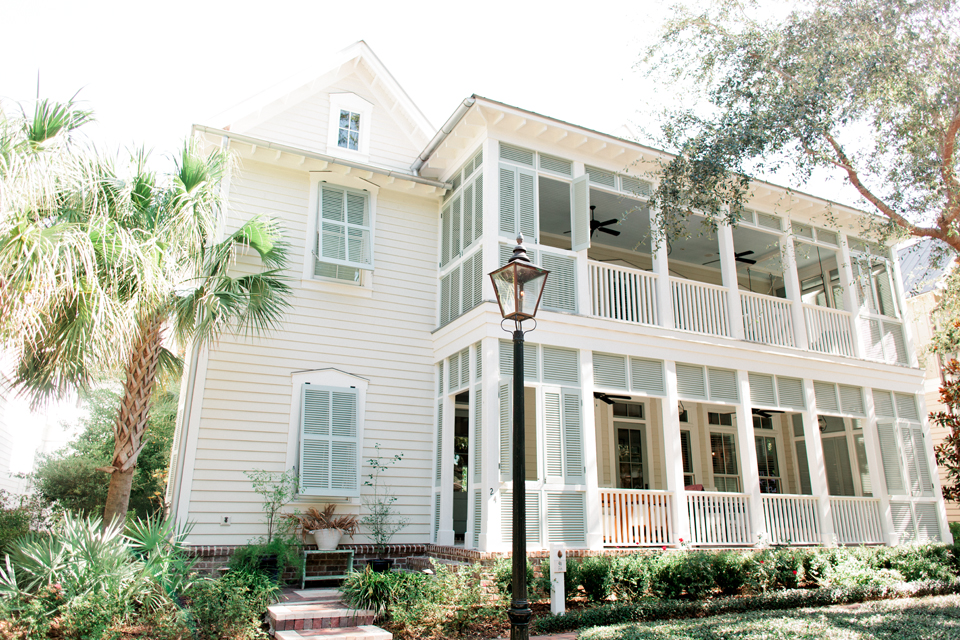 Image of a coastal South Carolina home in Montage Plametto Bluff.  It is a two-story house with porches and shutters.